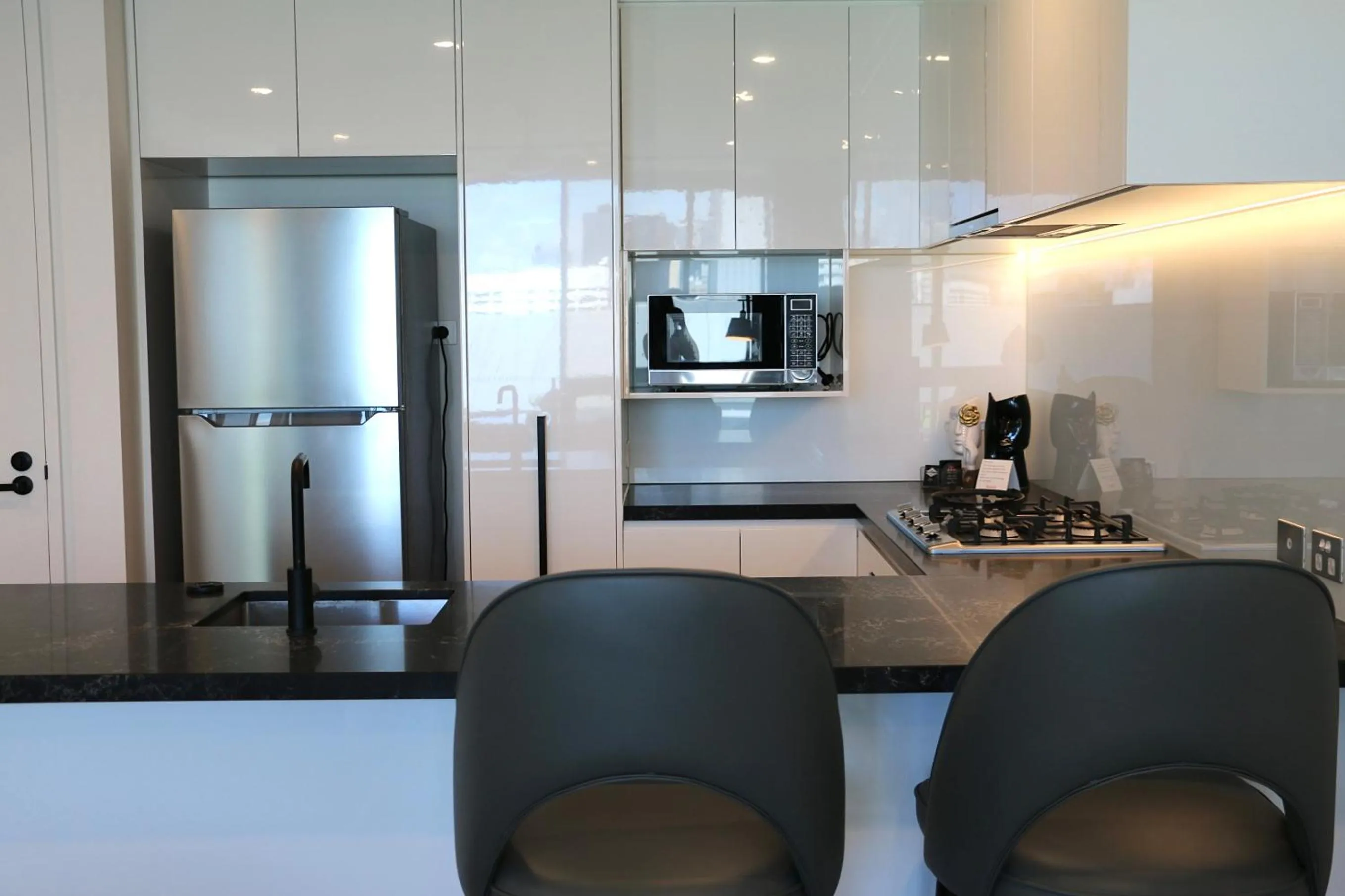 Kitchen or kitchenette in Kooii Apartments