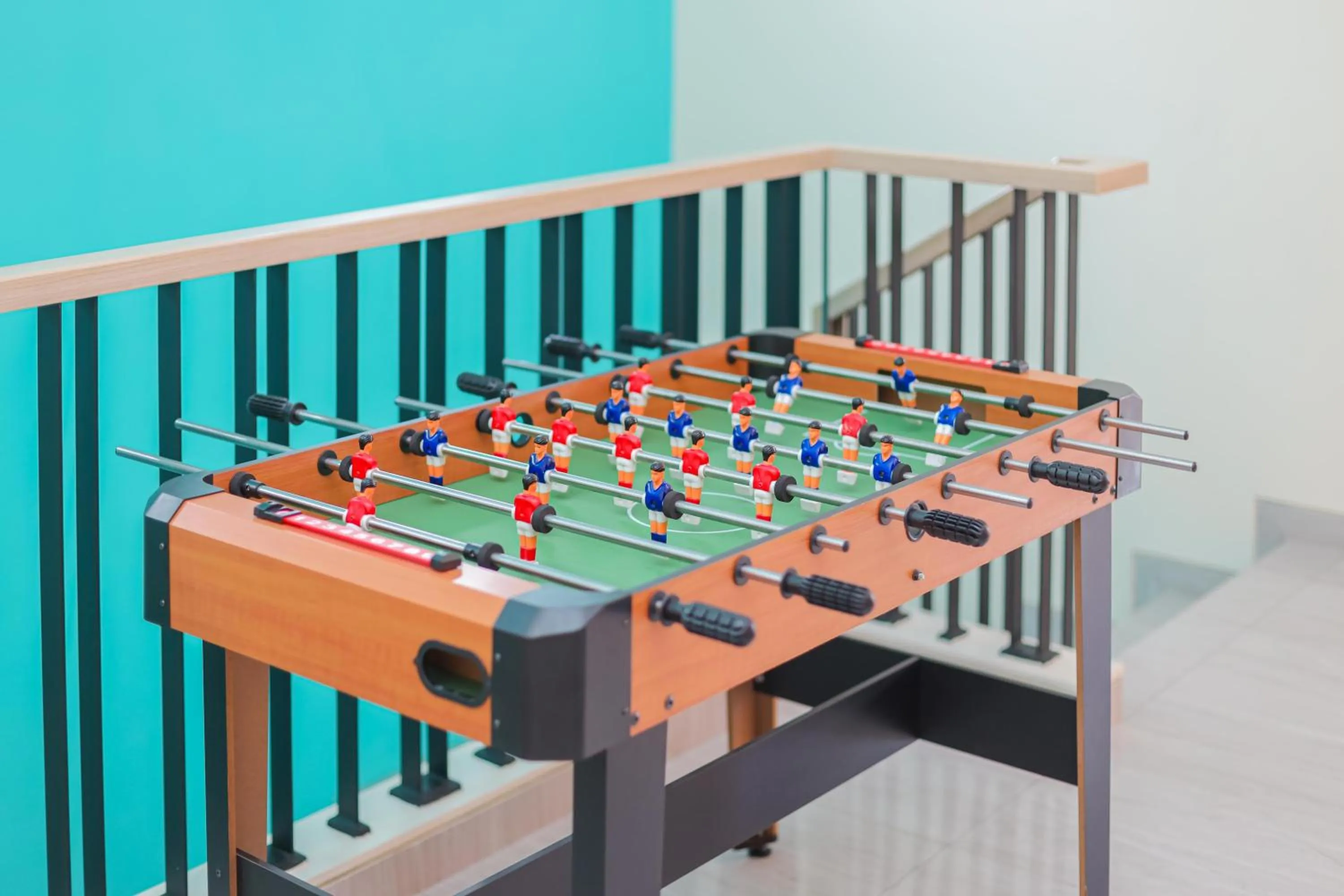 Game Room in Sans Hotel Clover Ace Surabaya by RedDoorz