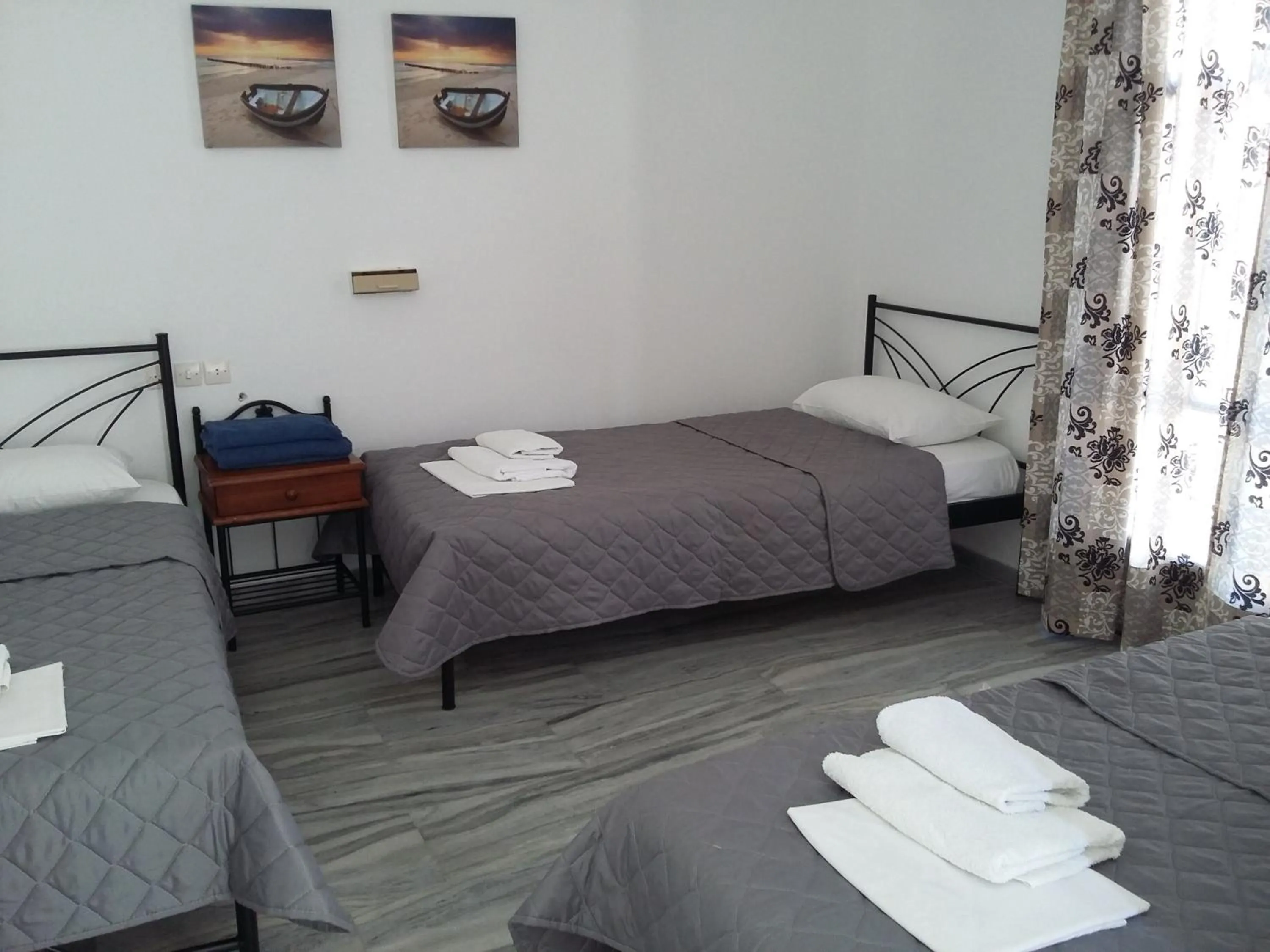 Bed in Rita's Place Hotel