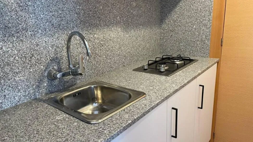 Kitchen or kitchenette in Apartamentos El Sol II