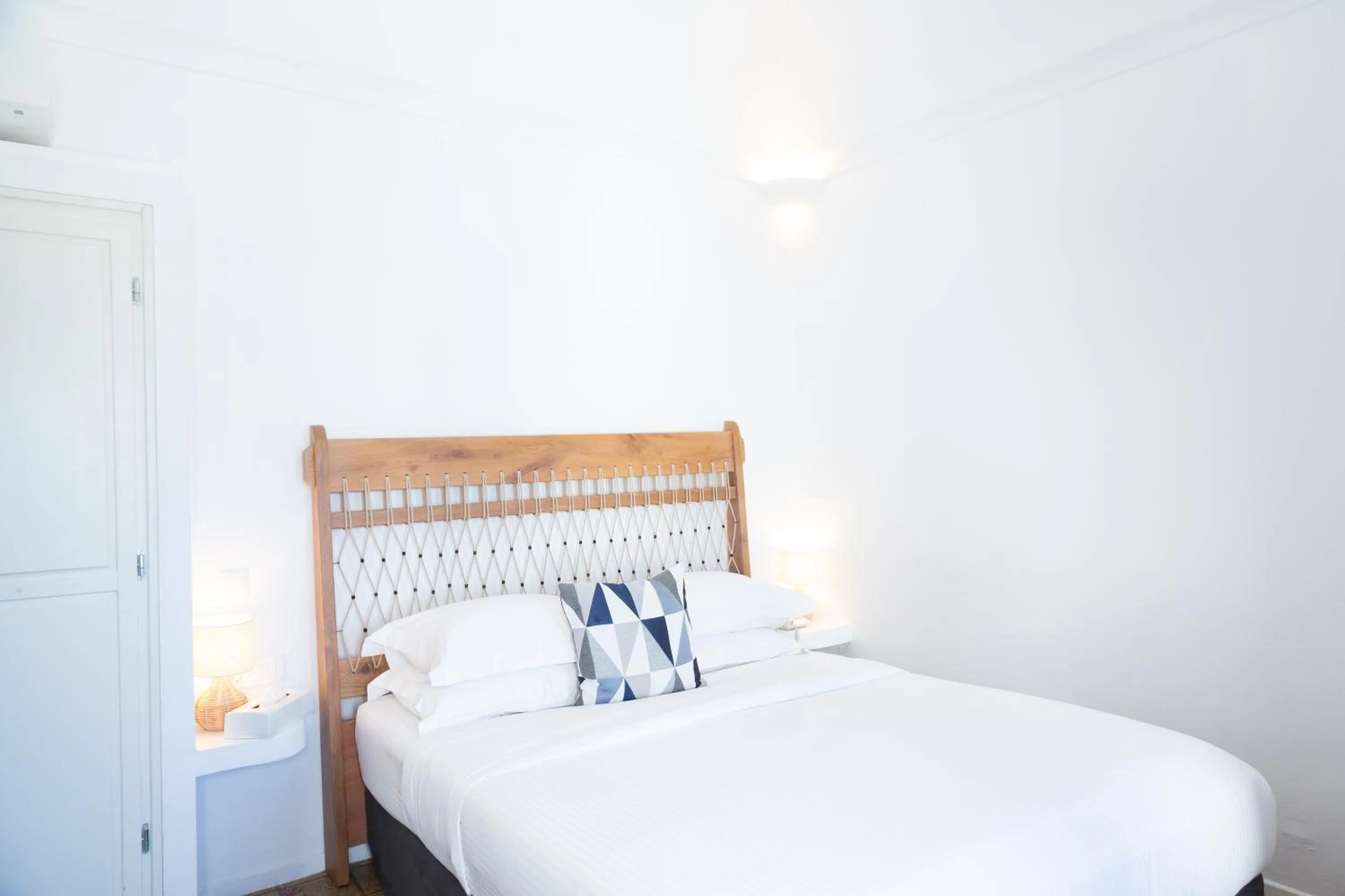 Bed in Pantelia Suites