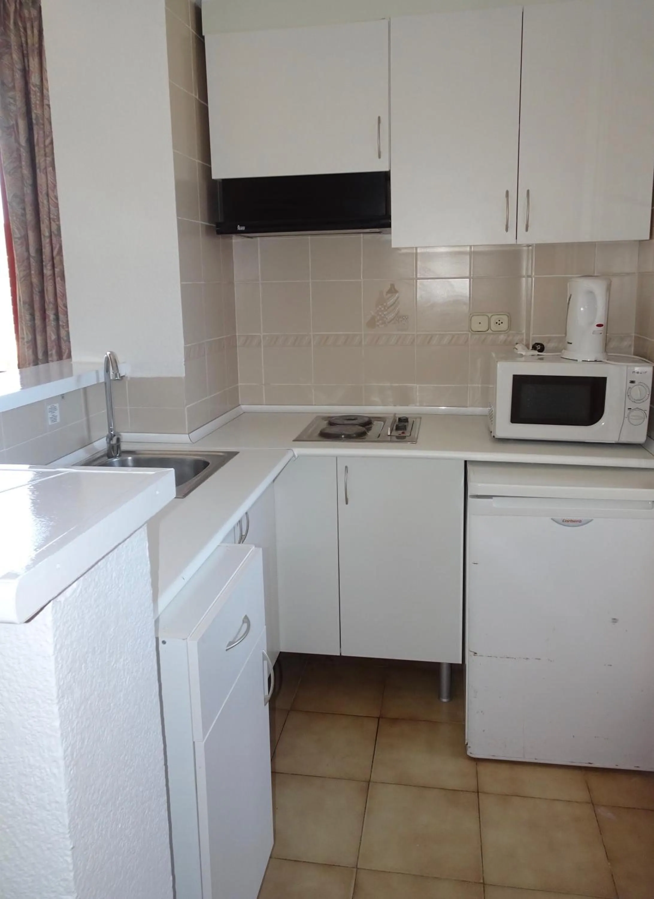 Kitchen or kitchenette in Evamar Apartments