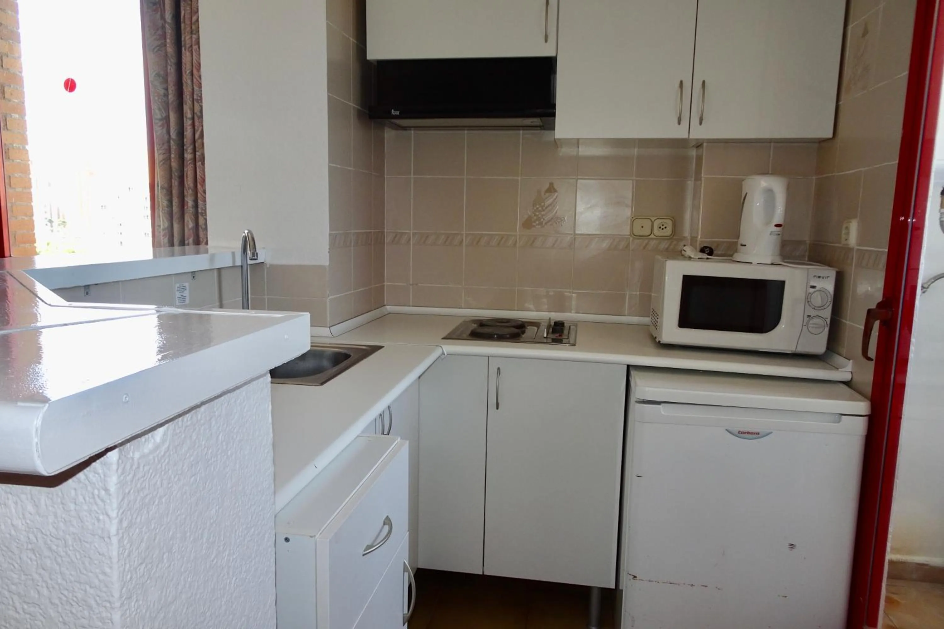 Kitchen or kitchenette in Evamar Apartments