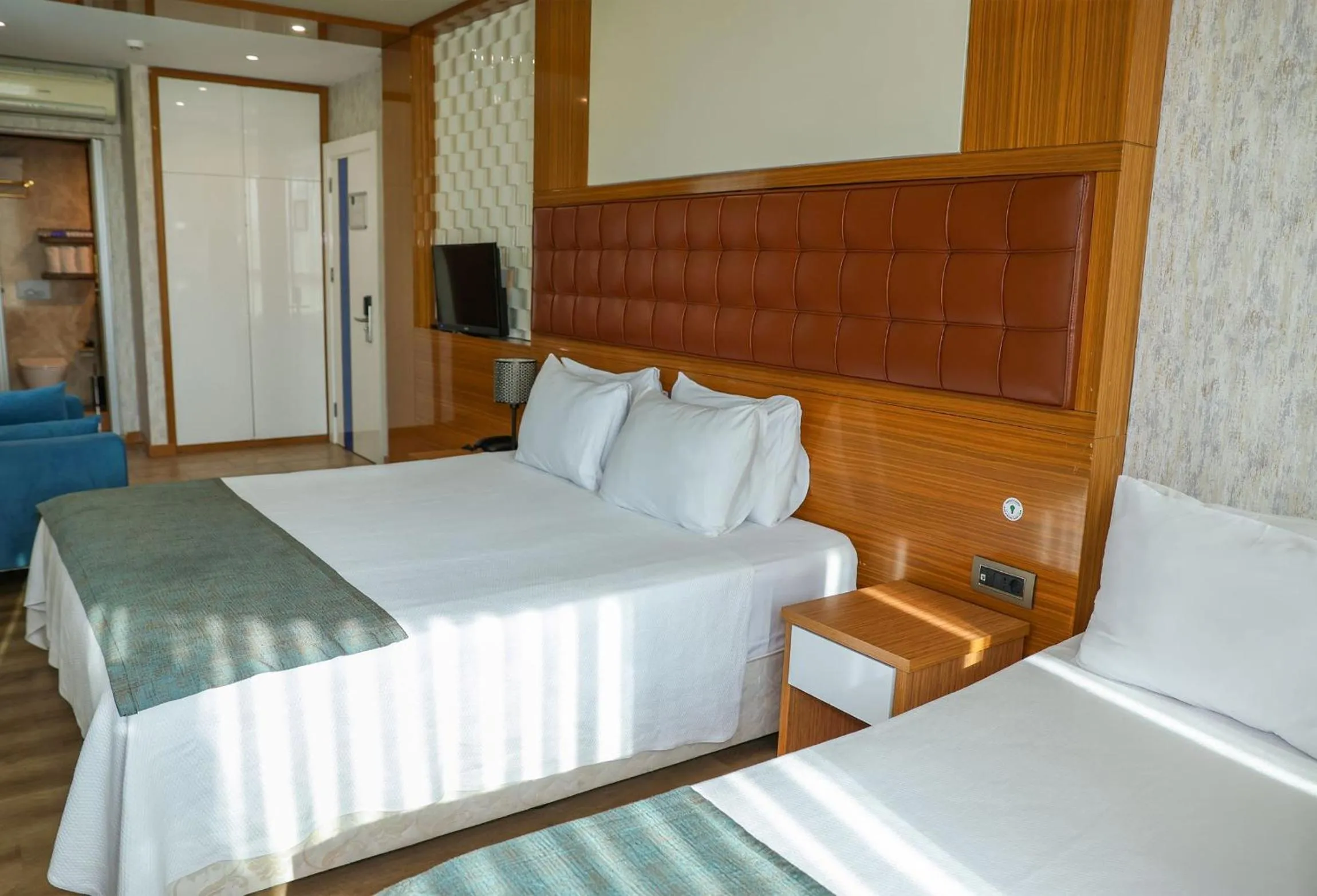 Bed in The Hera Platinum Hotel