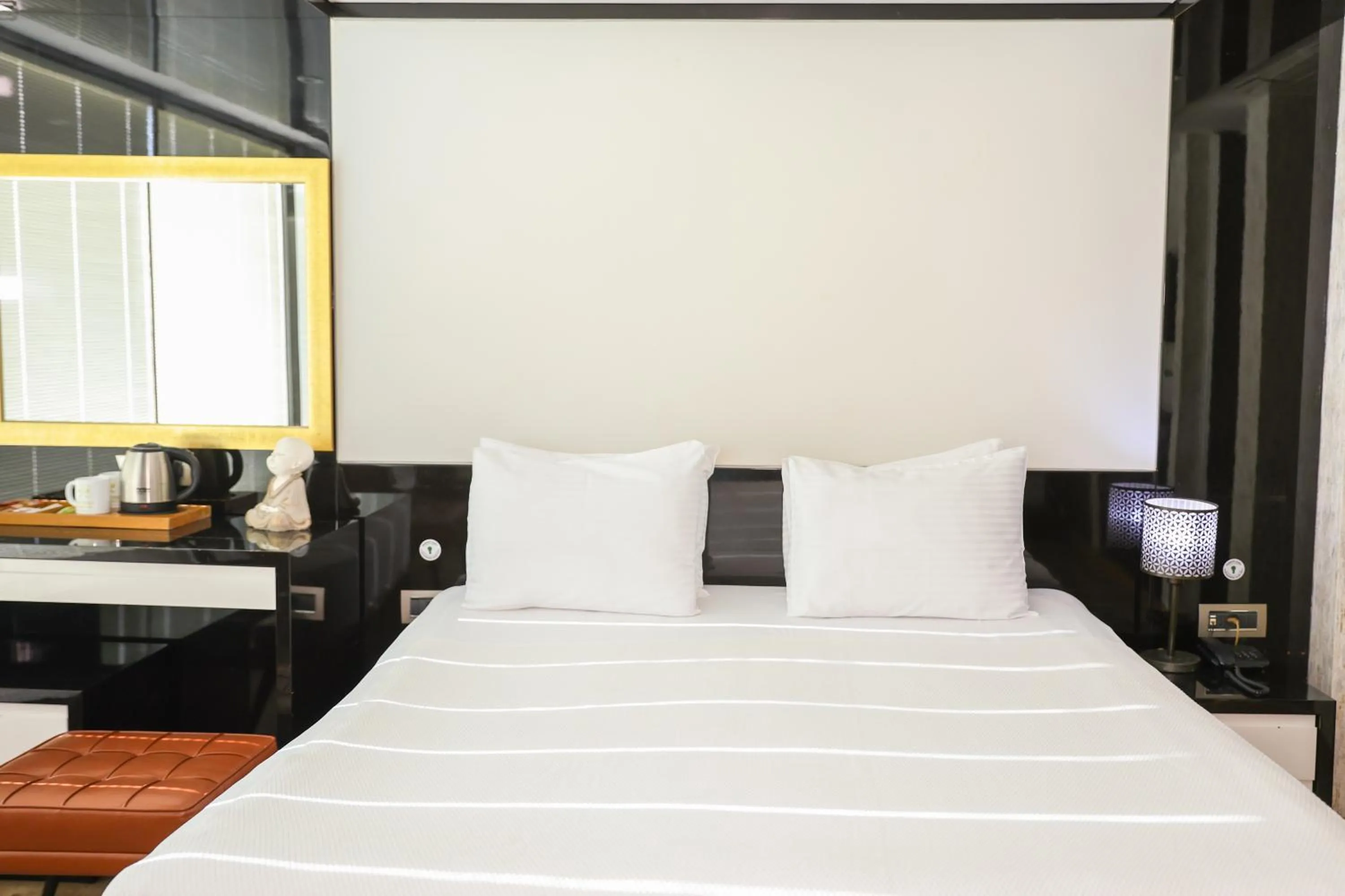 Bed in The Hera Platinum Hotel