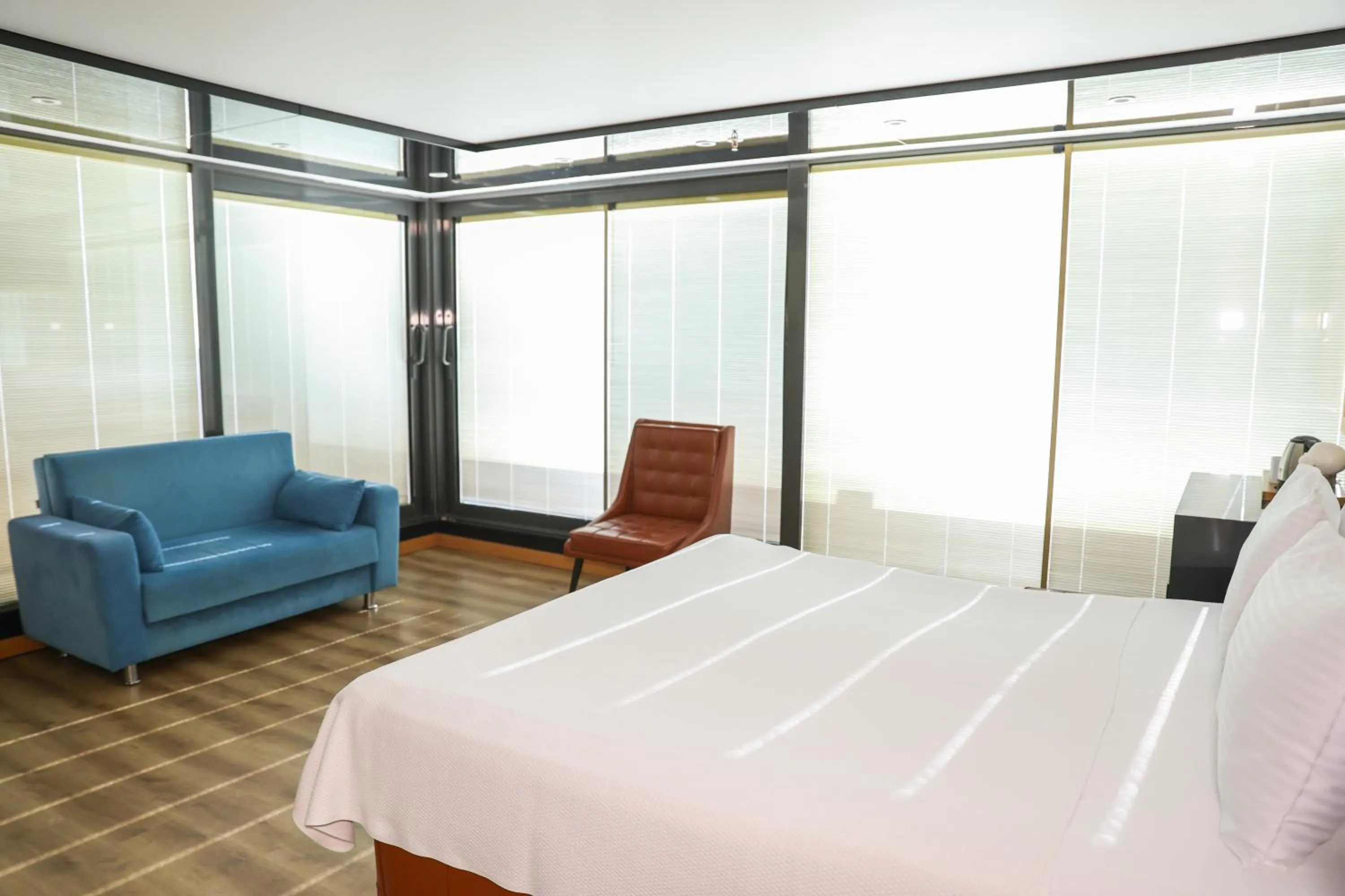 Bed in The Hera Platinum Hotel