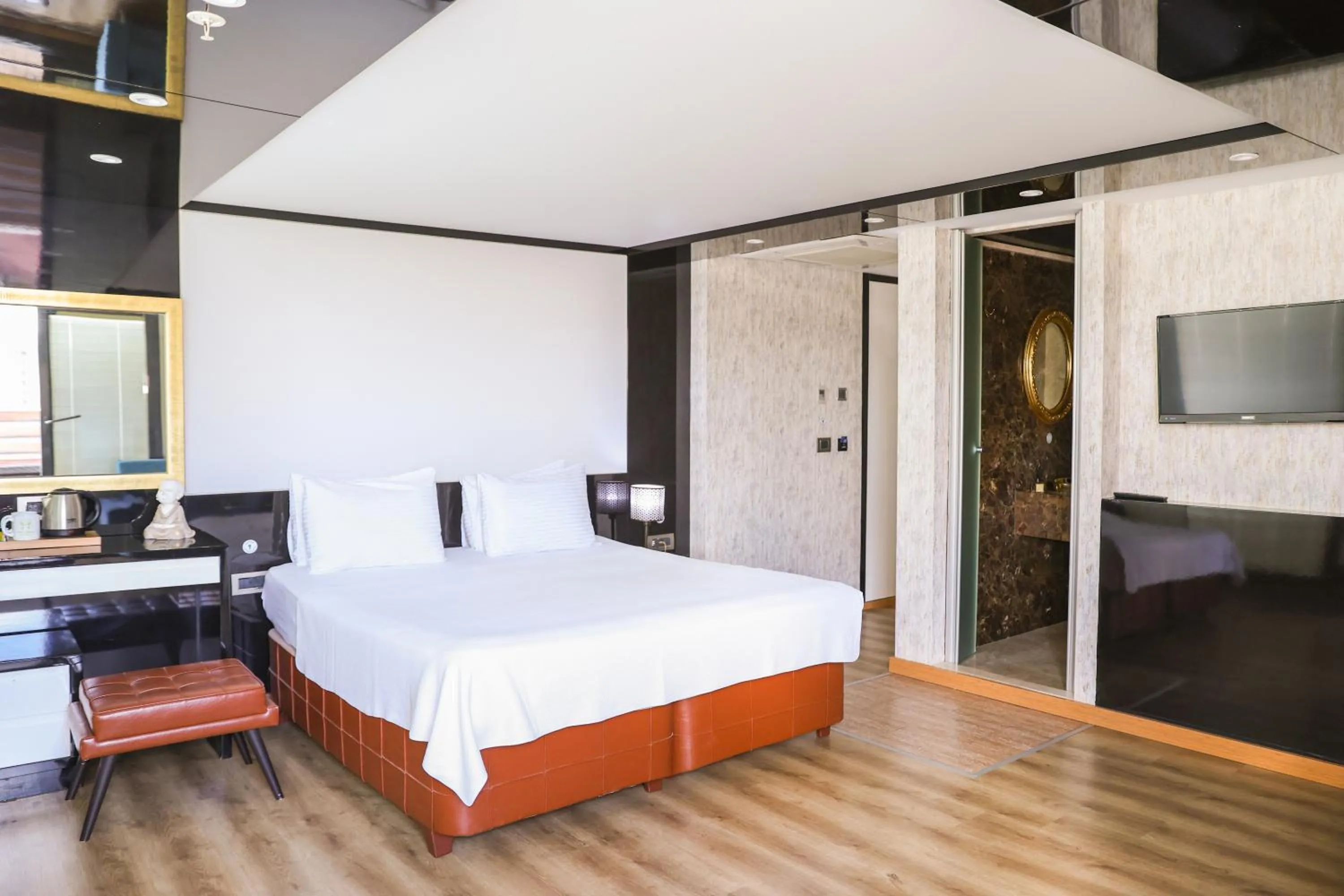 Bed in The Hera Platinum Hotel