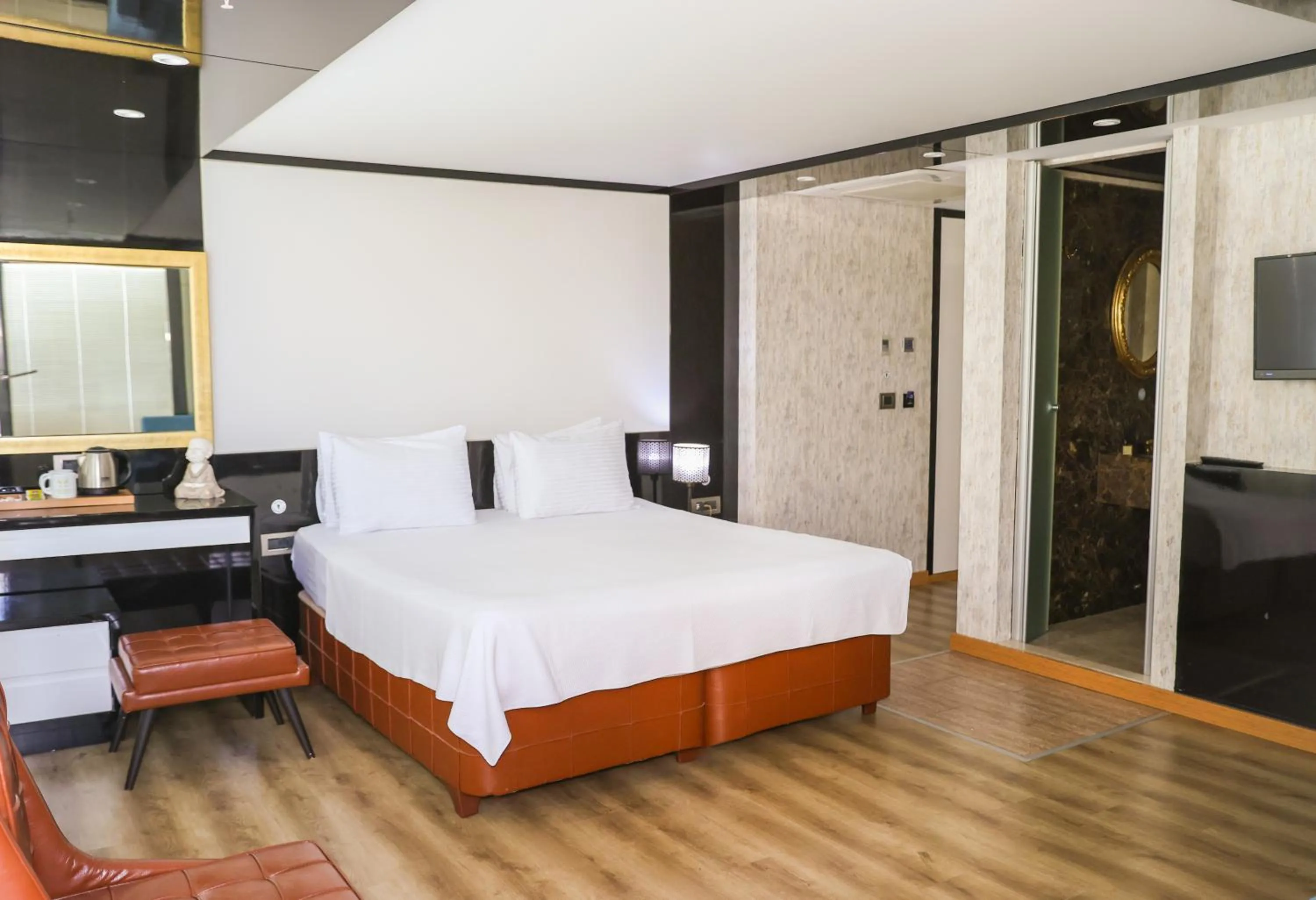 Bed in The Hera Platinum Hotel