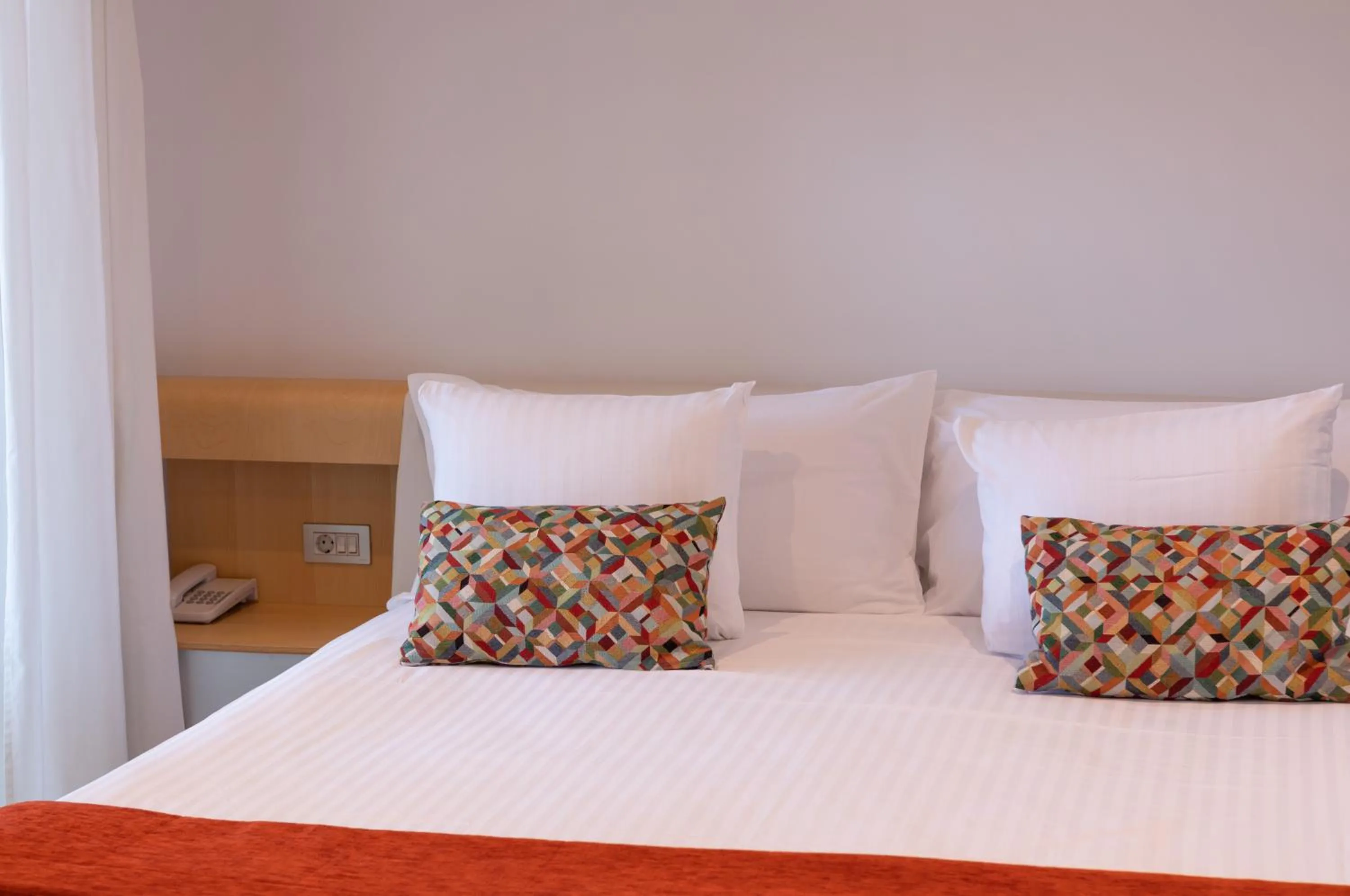 Bed in NM Suites by Escampa Hotels