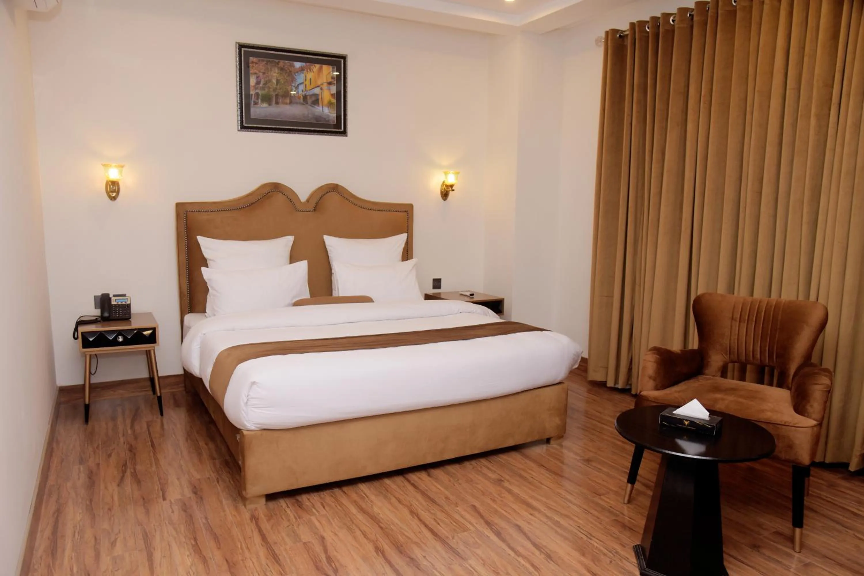 Bed in The Rich Hotel & Apartments