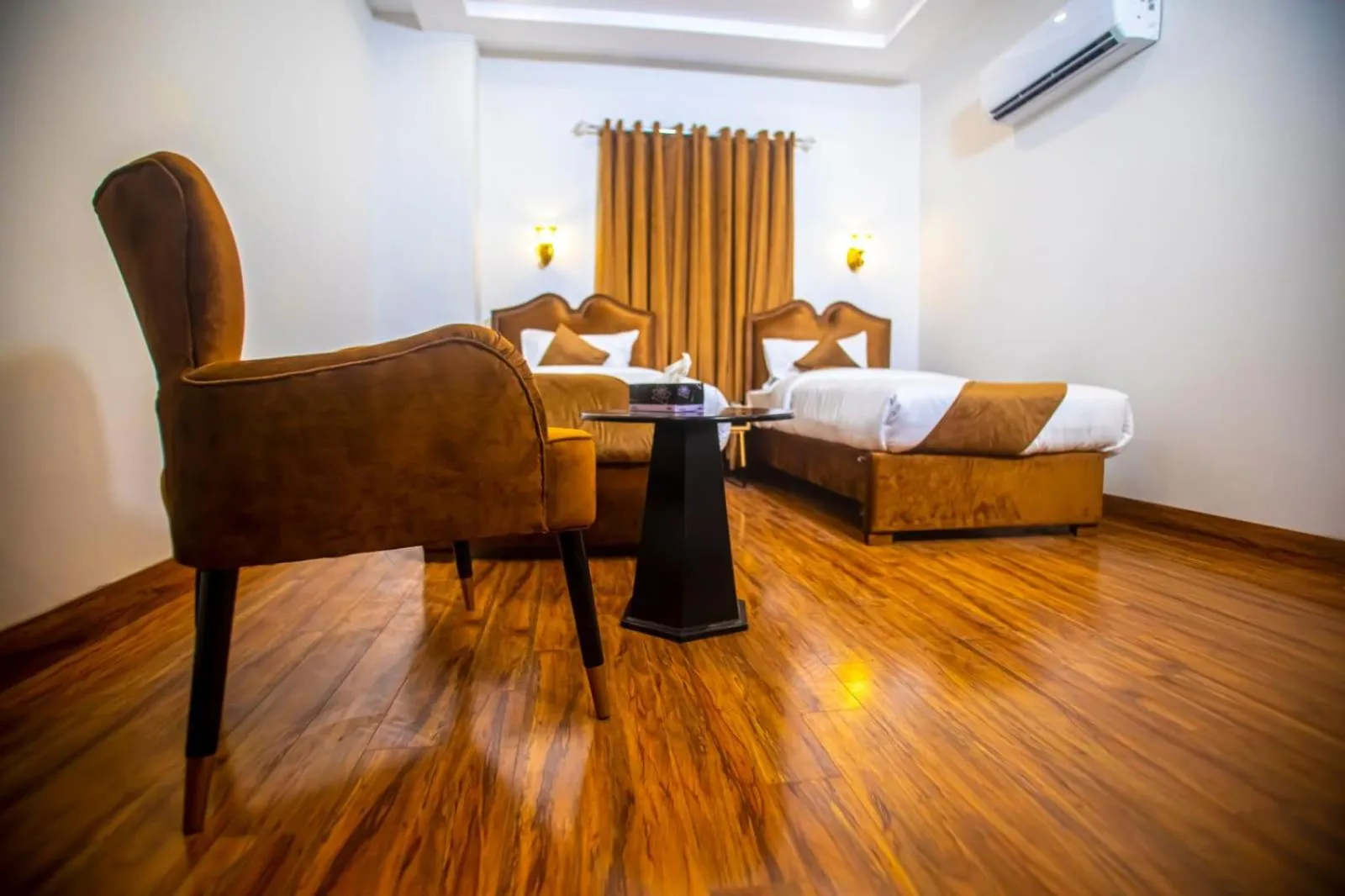 Bed in The Rich Hotel & Apartments