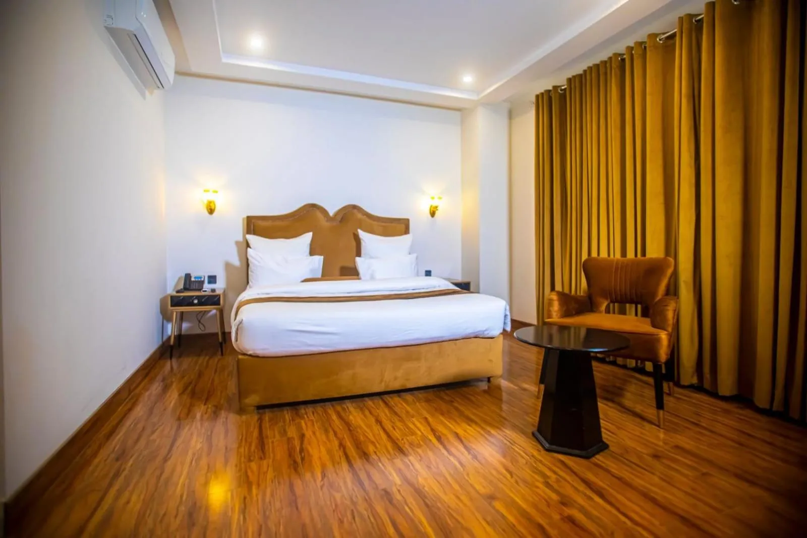 Bed in The Rich Hotel & Apartments