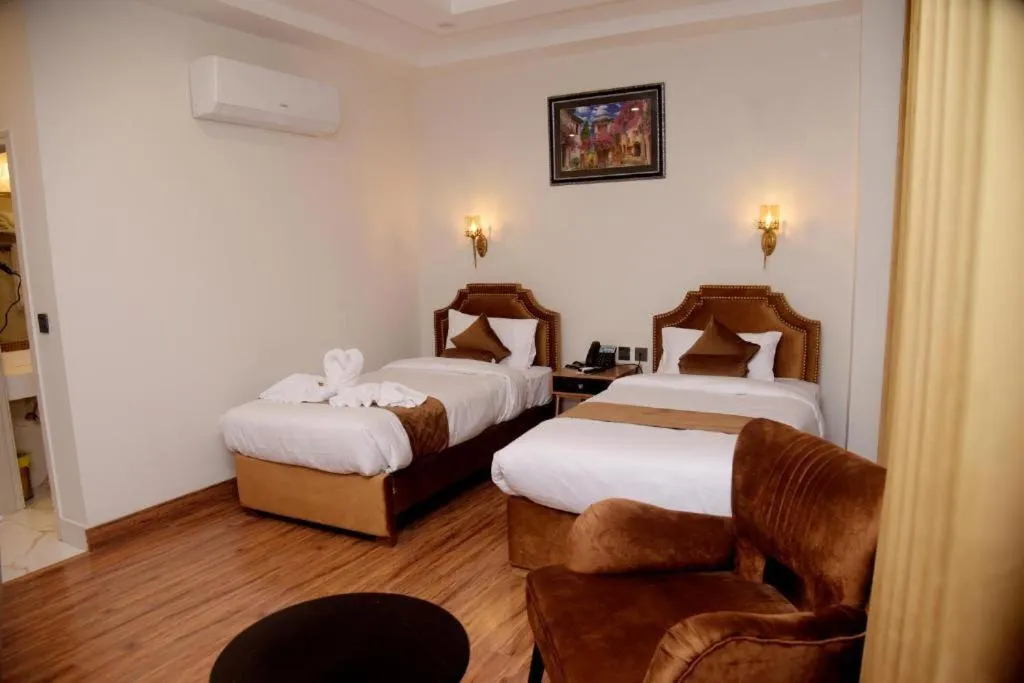 Bedroom, Bed in The Rich Hotel & Apartments