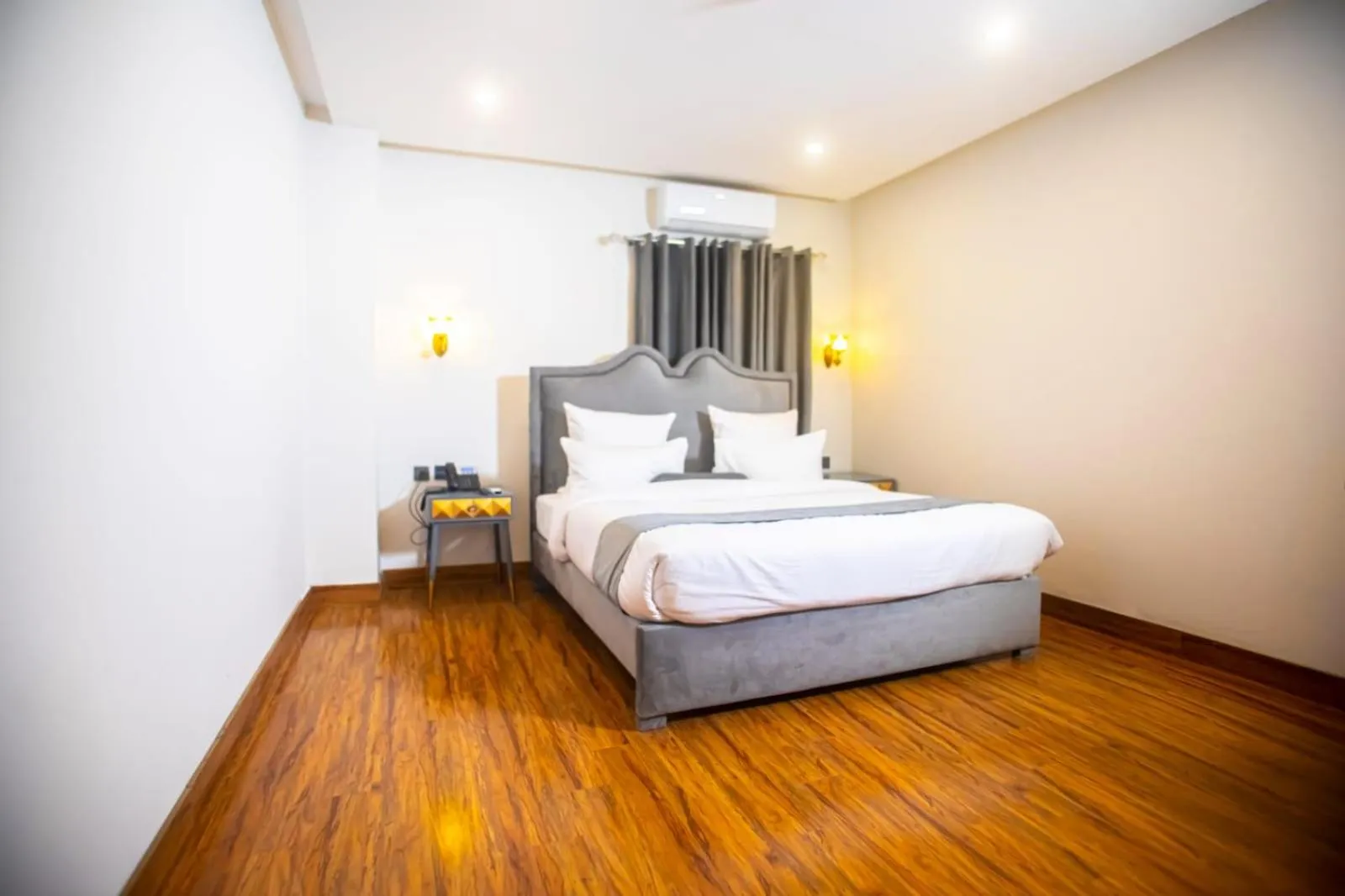 Bed in The Rich Hotel & Apartments