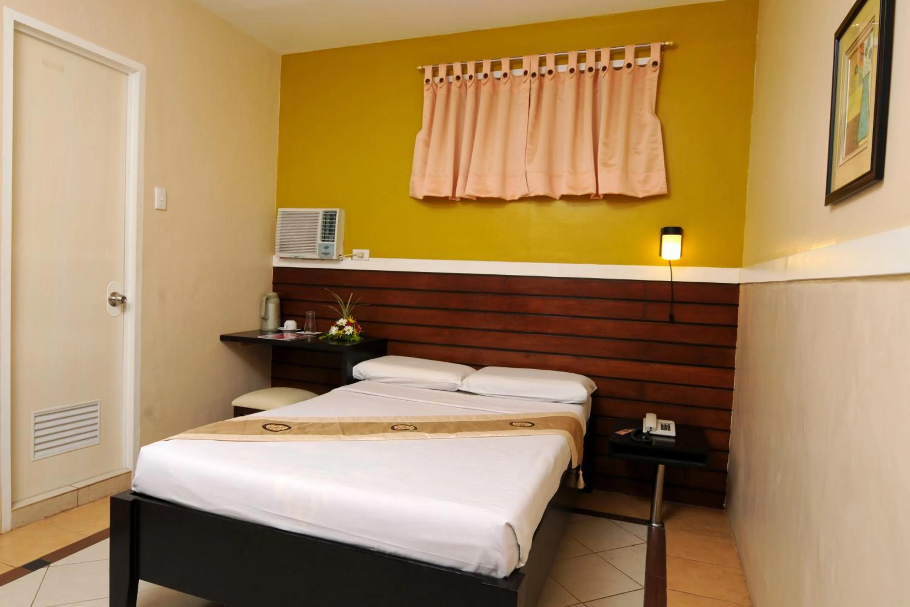 Bed in Sampaguita Suites JRG