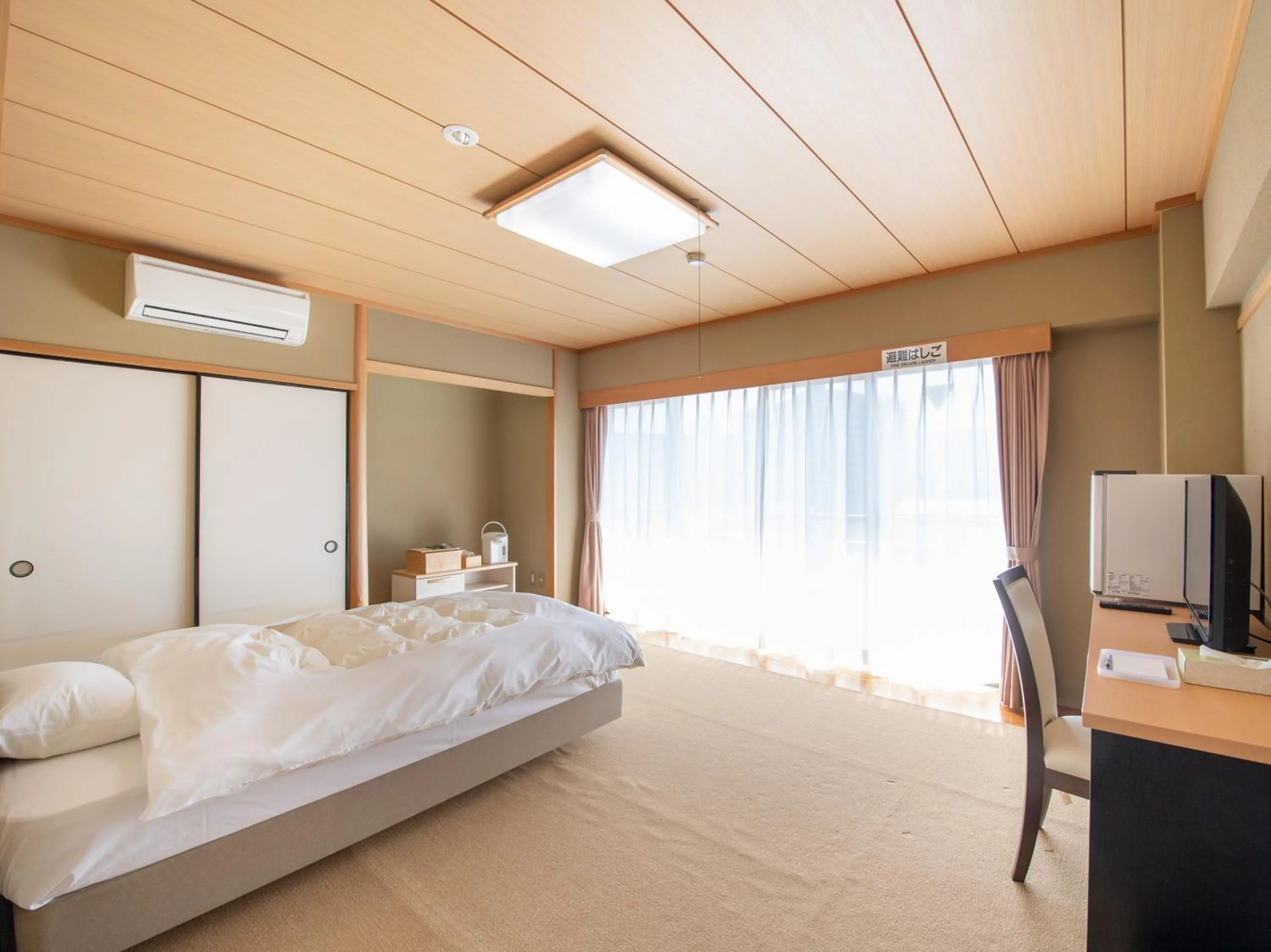 Bed in Chateraise Lodge Kasugai