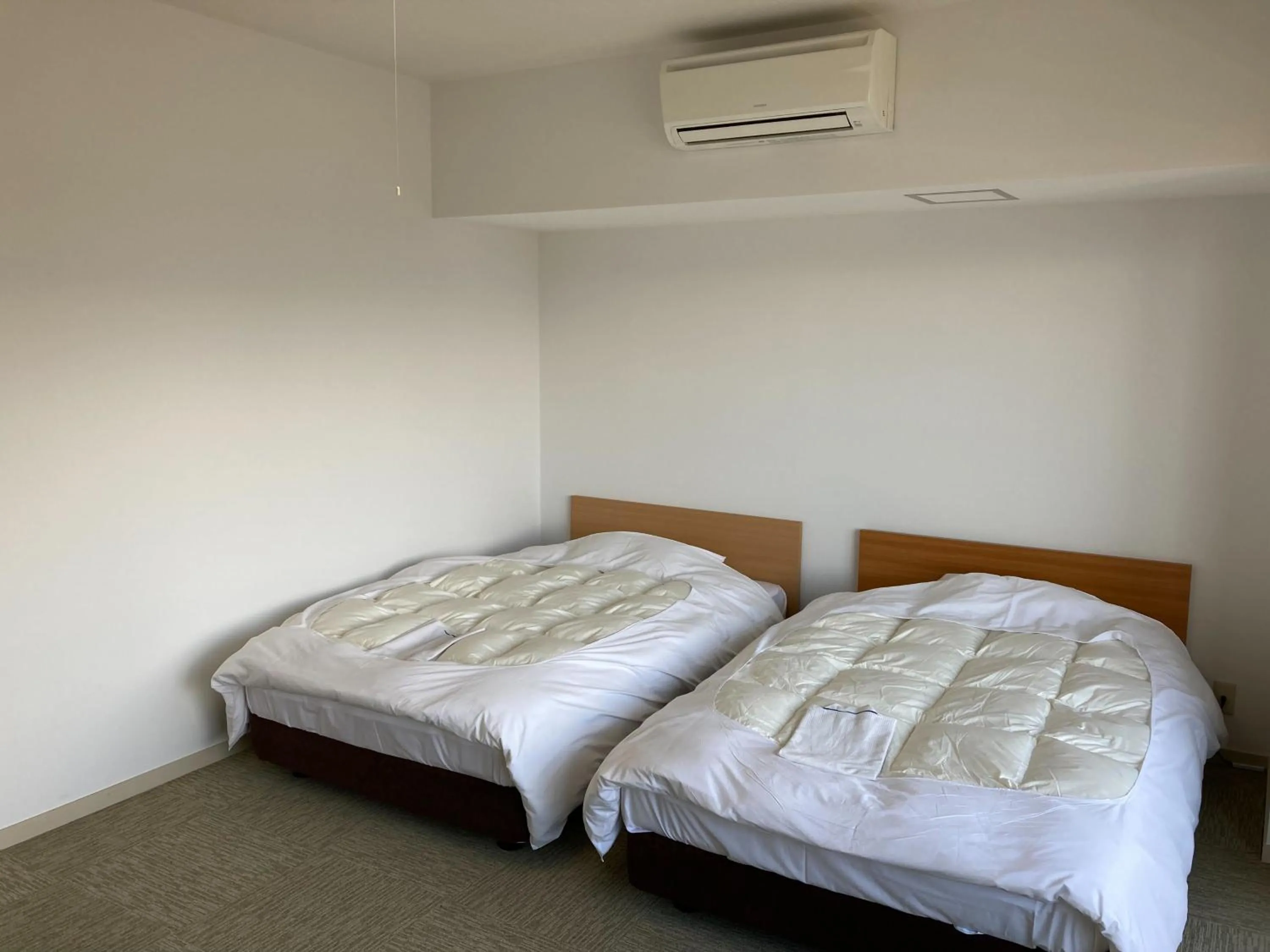 Bed in Chateraise Lodge Kasugai