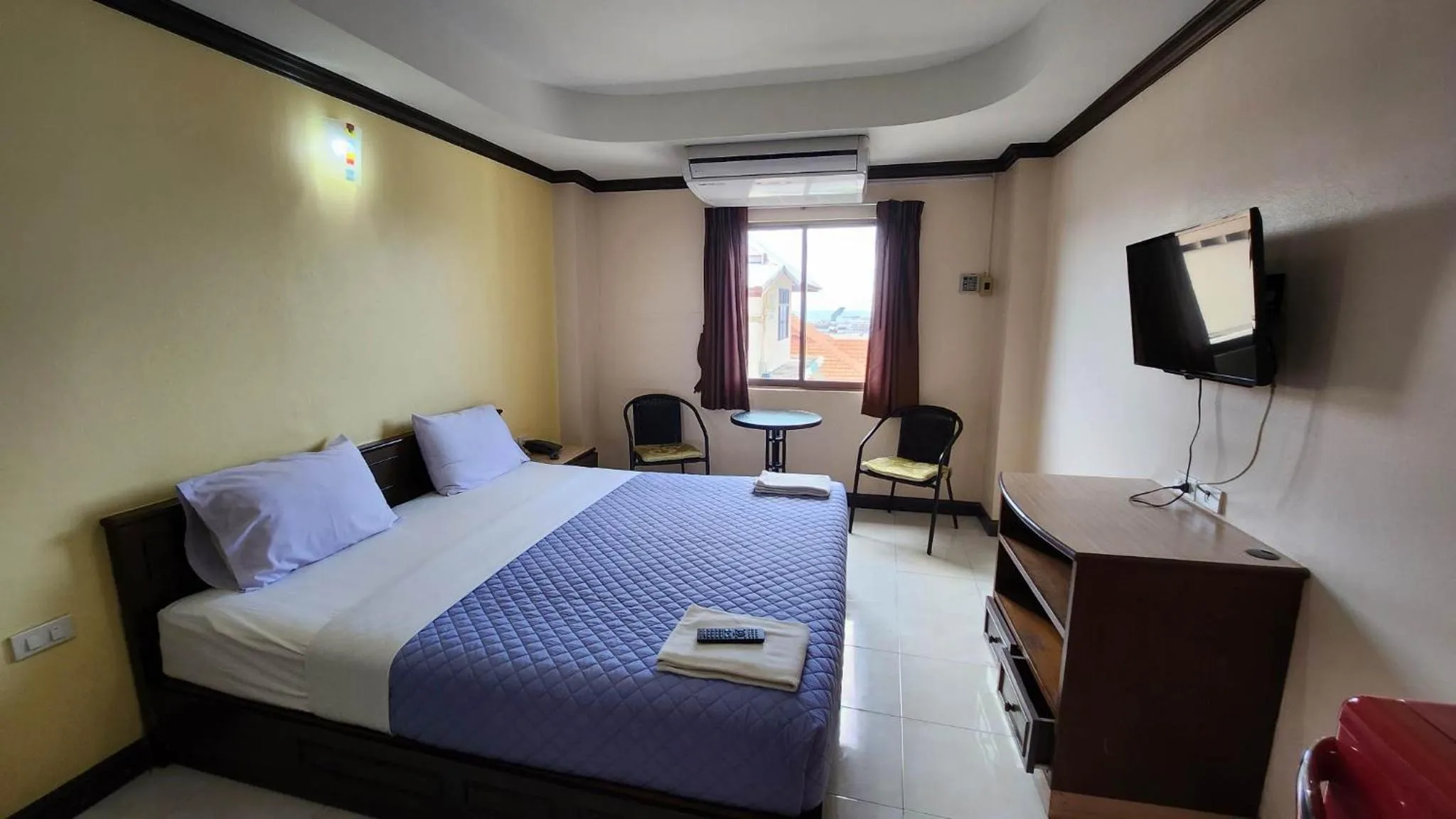 Bedroom in White Rose​ Hotel​ II​