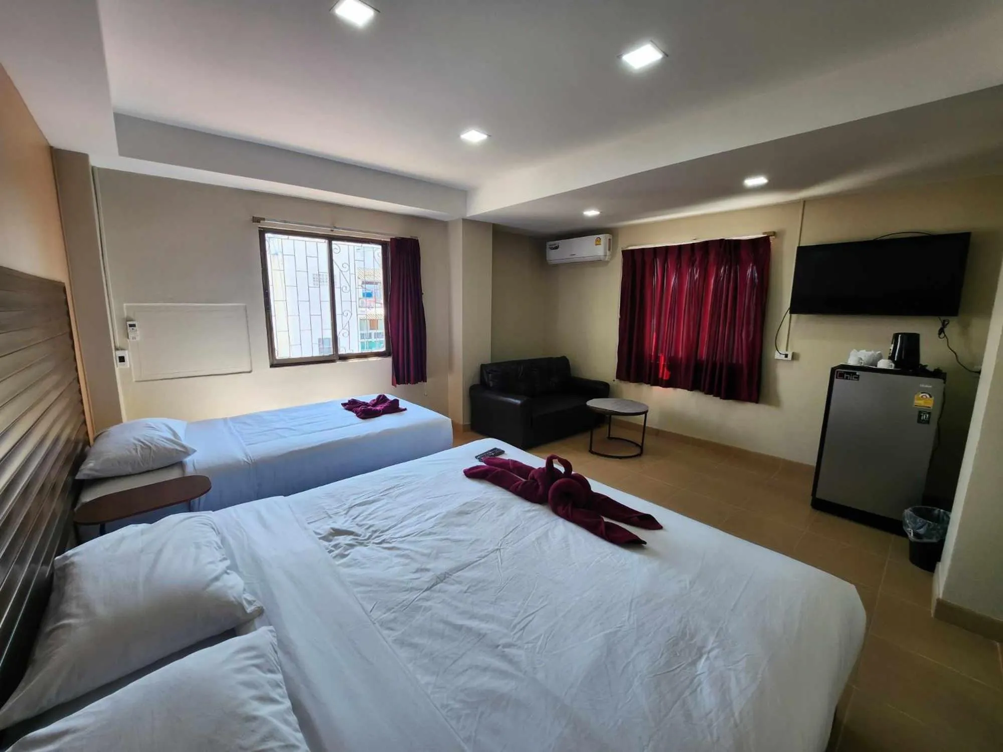 Bed in White Rose​ Hotel​ II​