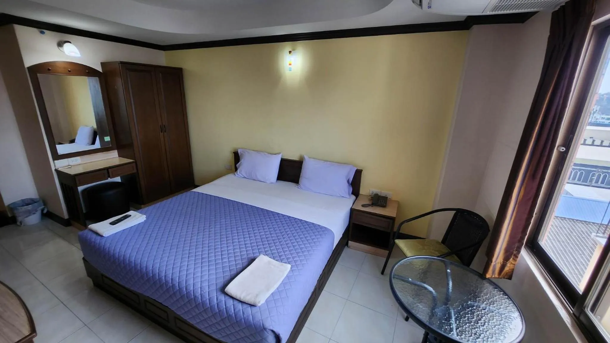 Bedroom in White Rose​ Hotel​ II​