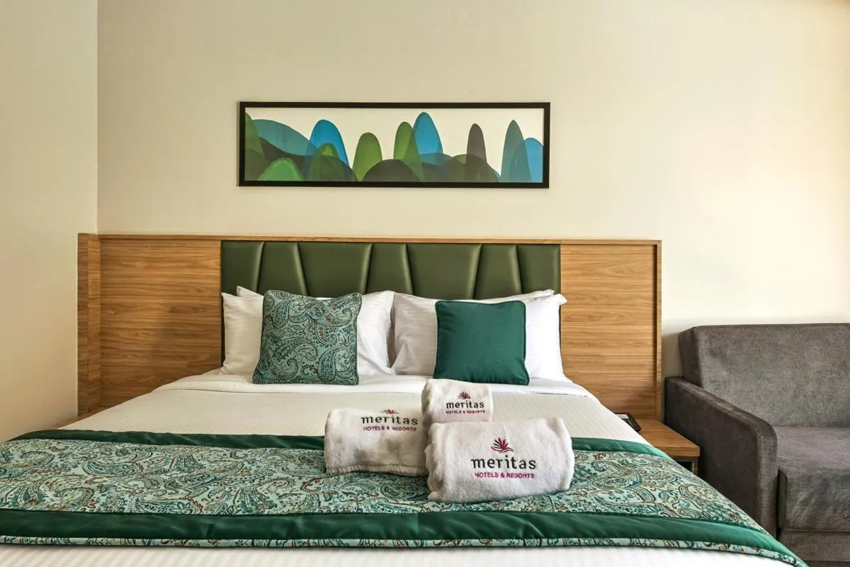 Bed in Meritas Aura Resort