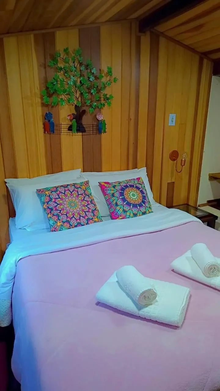 Bed in Pousada Bosque do Visconde