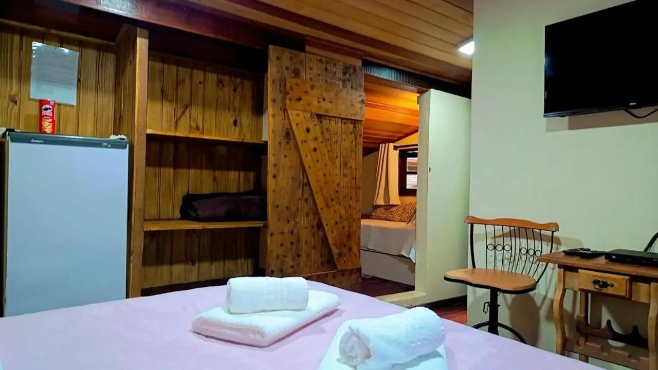 Bed in Pousada Bosque do Visconde