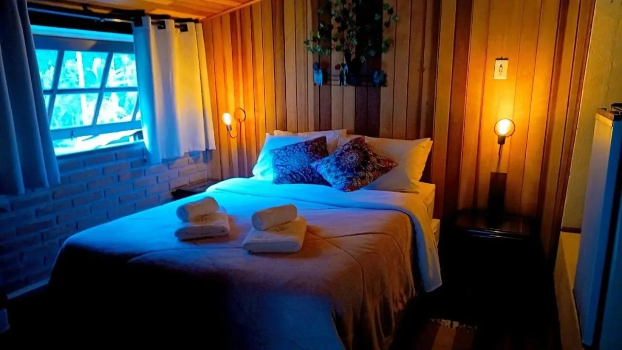 Bed in Pousada Bosque do Visconde