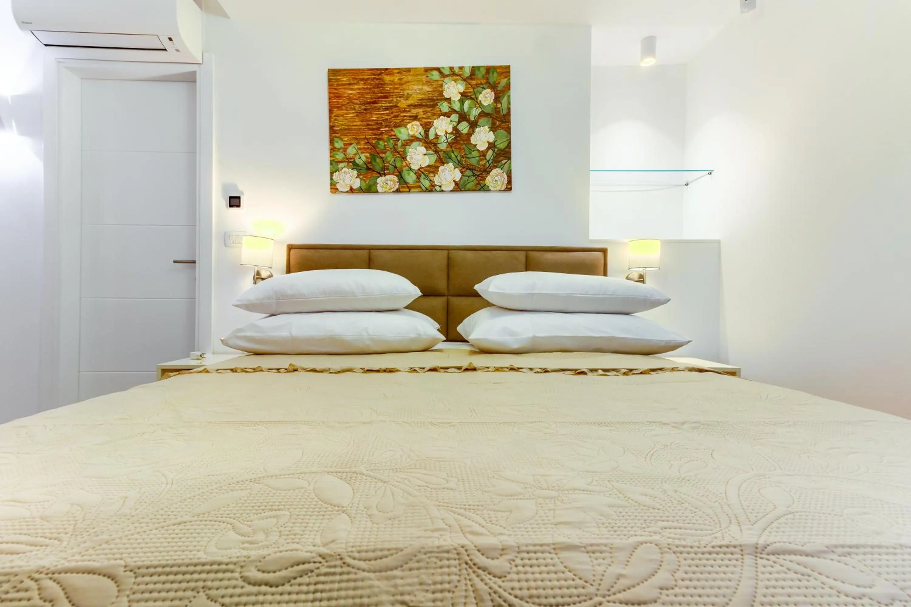 Bed in Irini Luxury Rooms