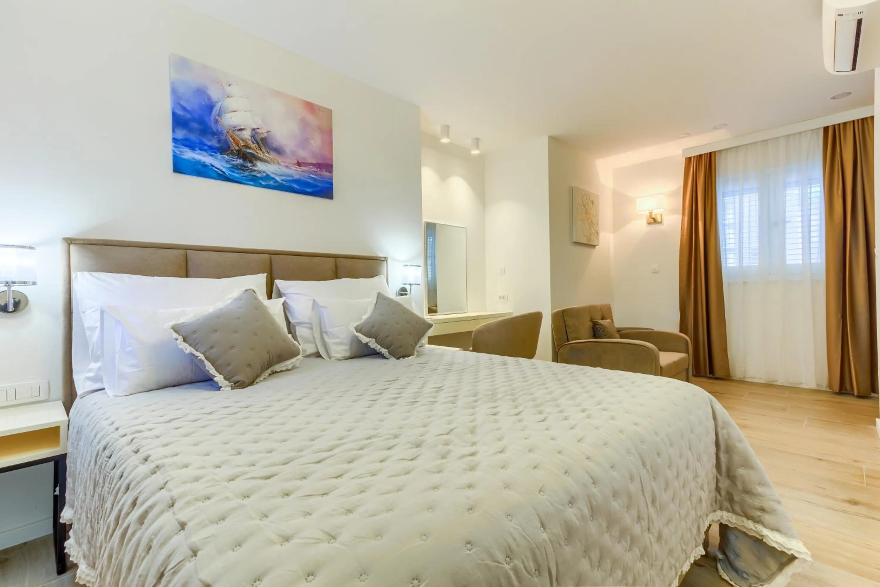 Bed in Irini Luxury Rooms