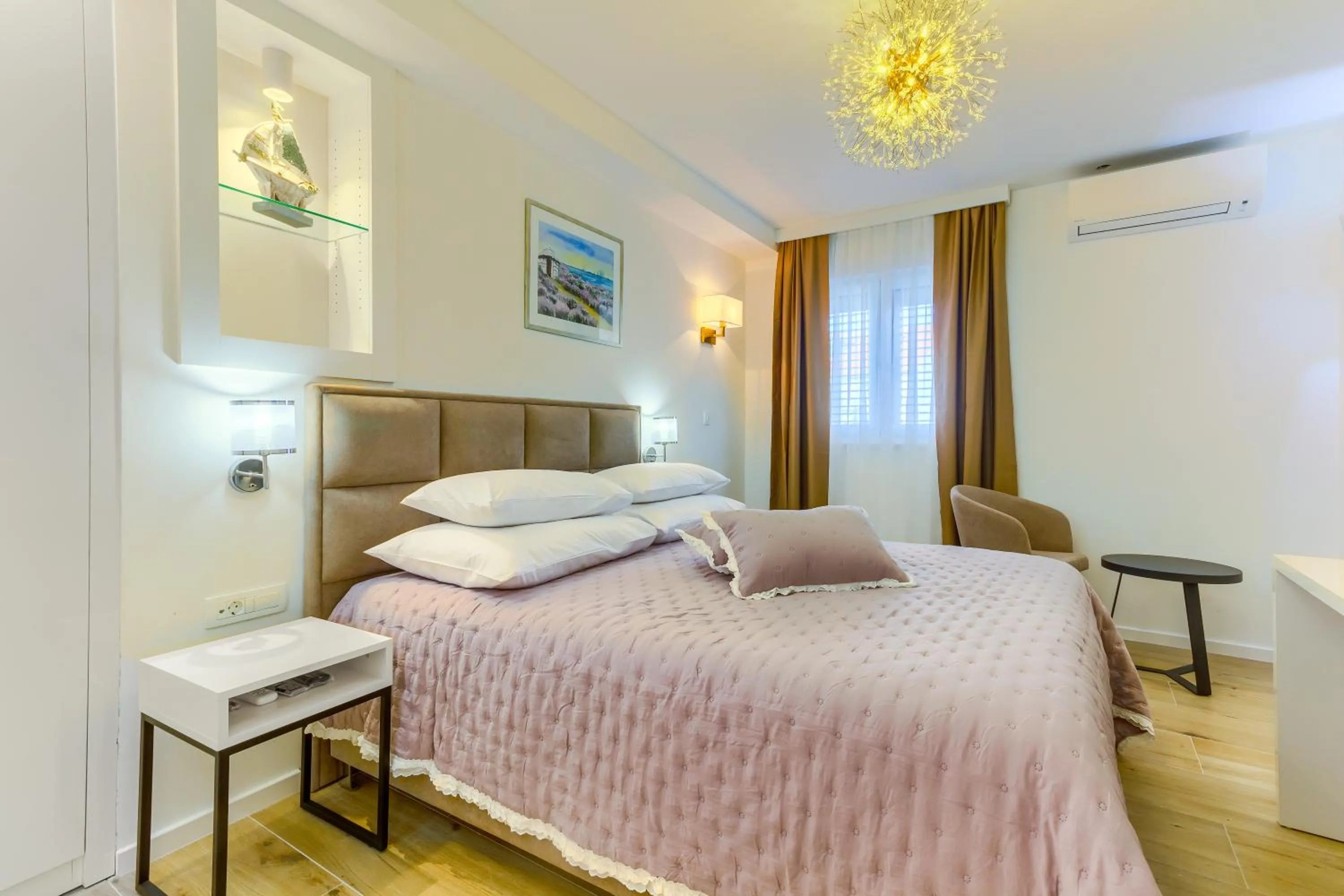 Bed in Irini Luxury Rooms