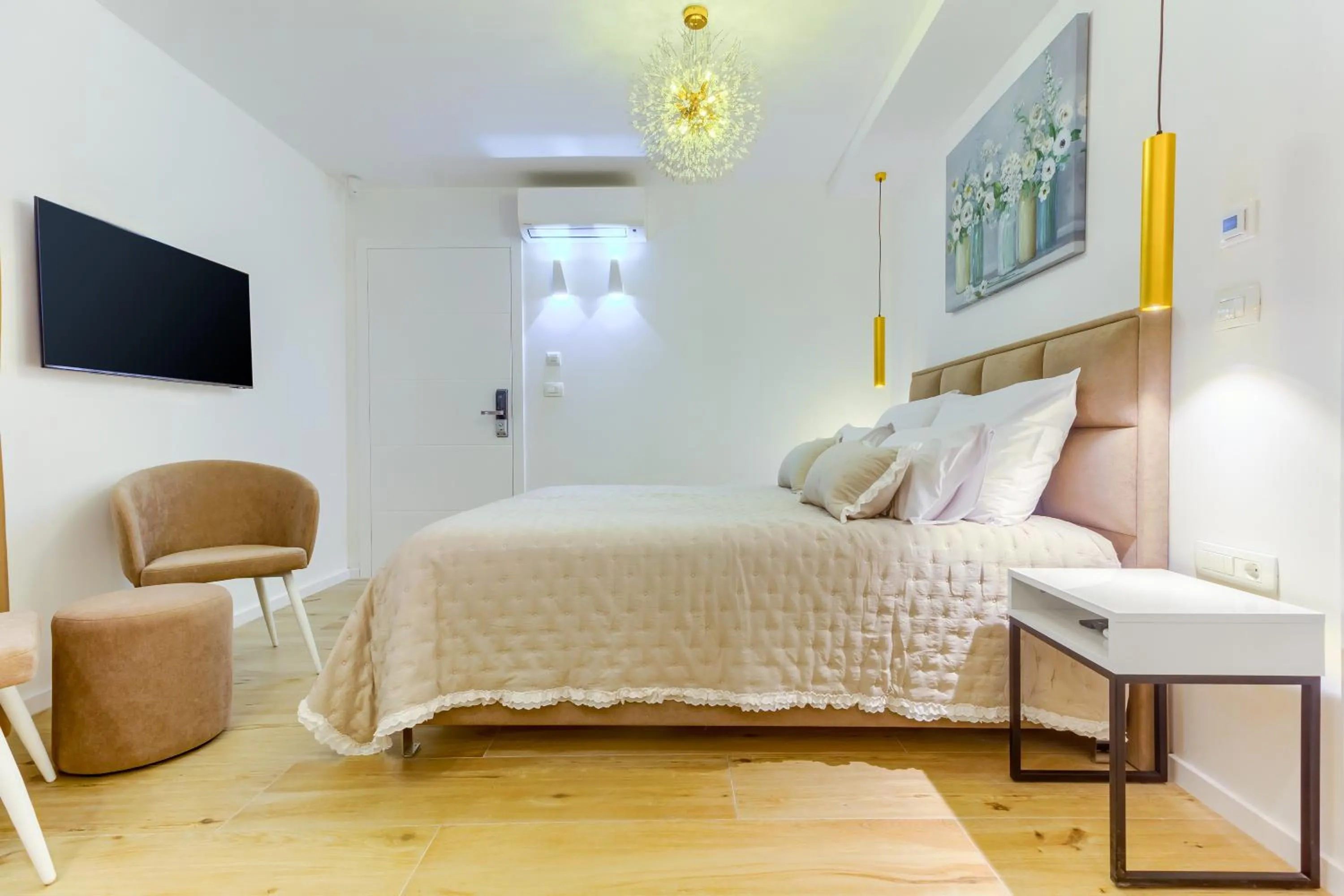 Bed in Irini Luxury Rooms