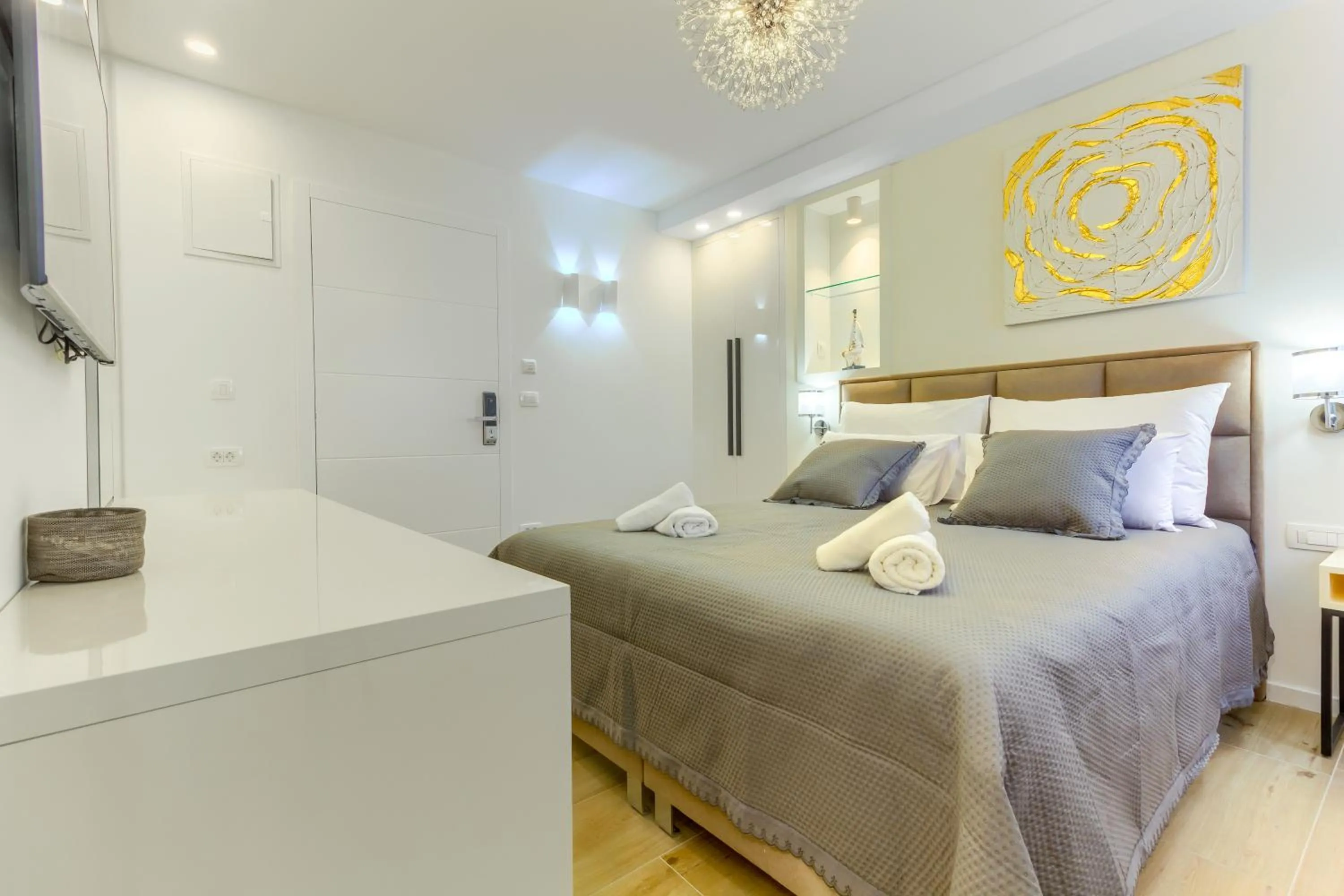 Bed in Irini Luxury Rooms