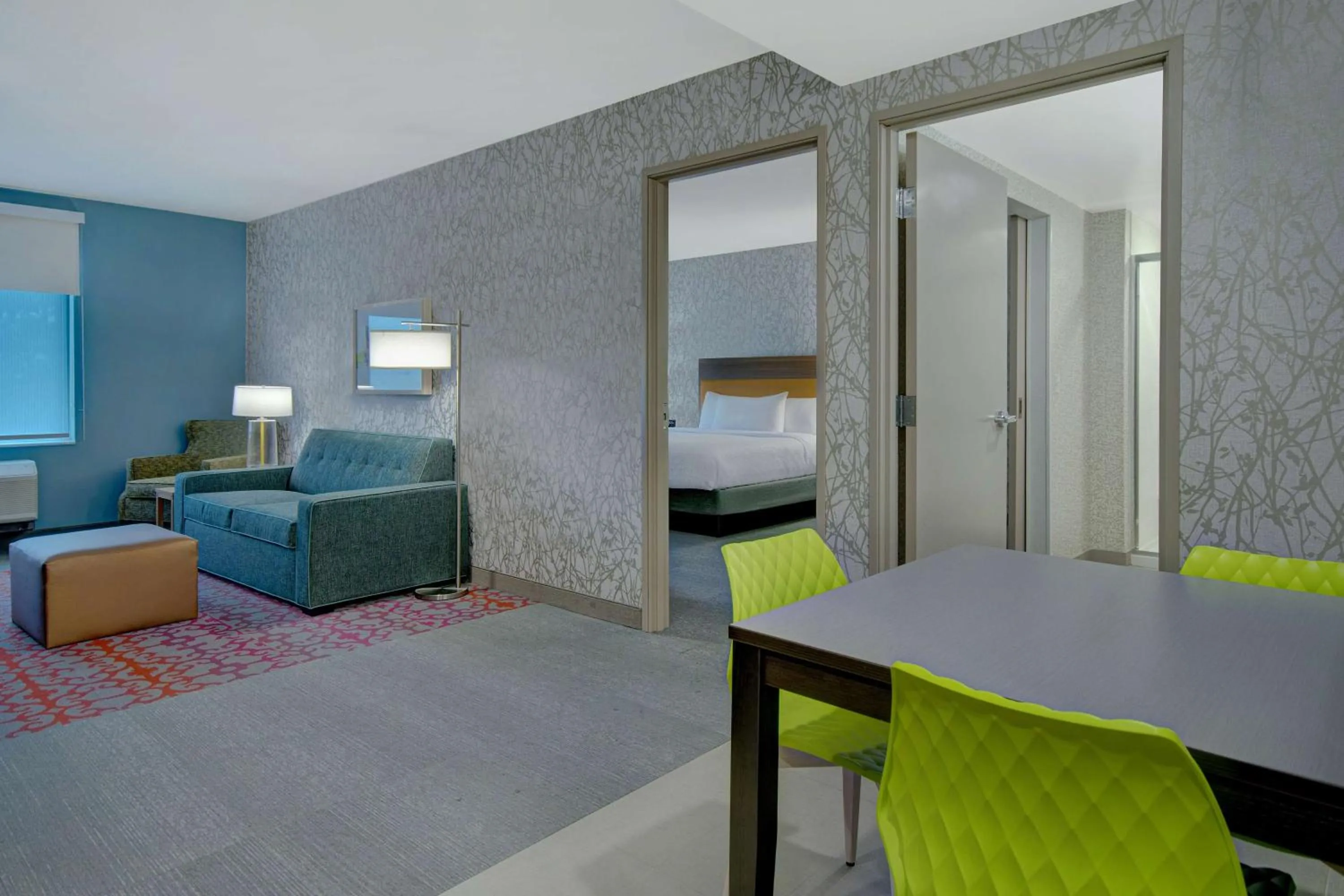 Living room, Bed in Home2 Suites By Hilton Grand Rapids Airport