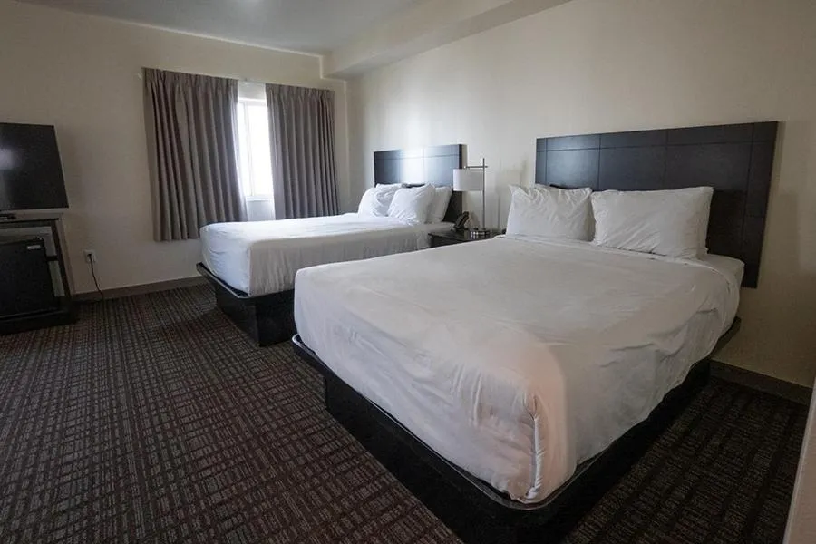 Bed in Cobblestone Hotel & Suites-Sheldon