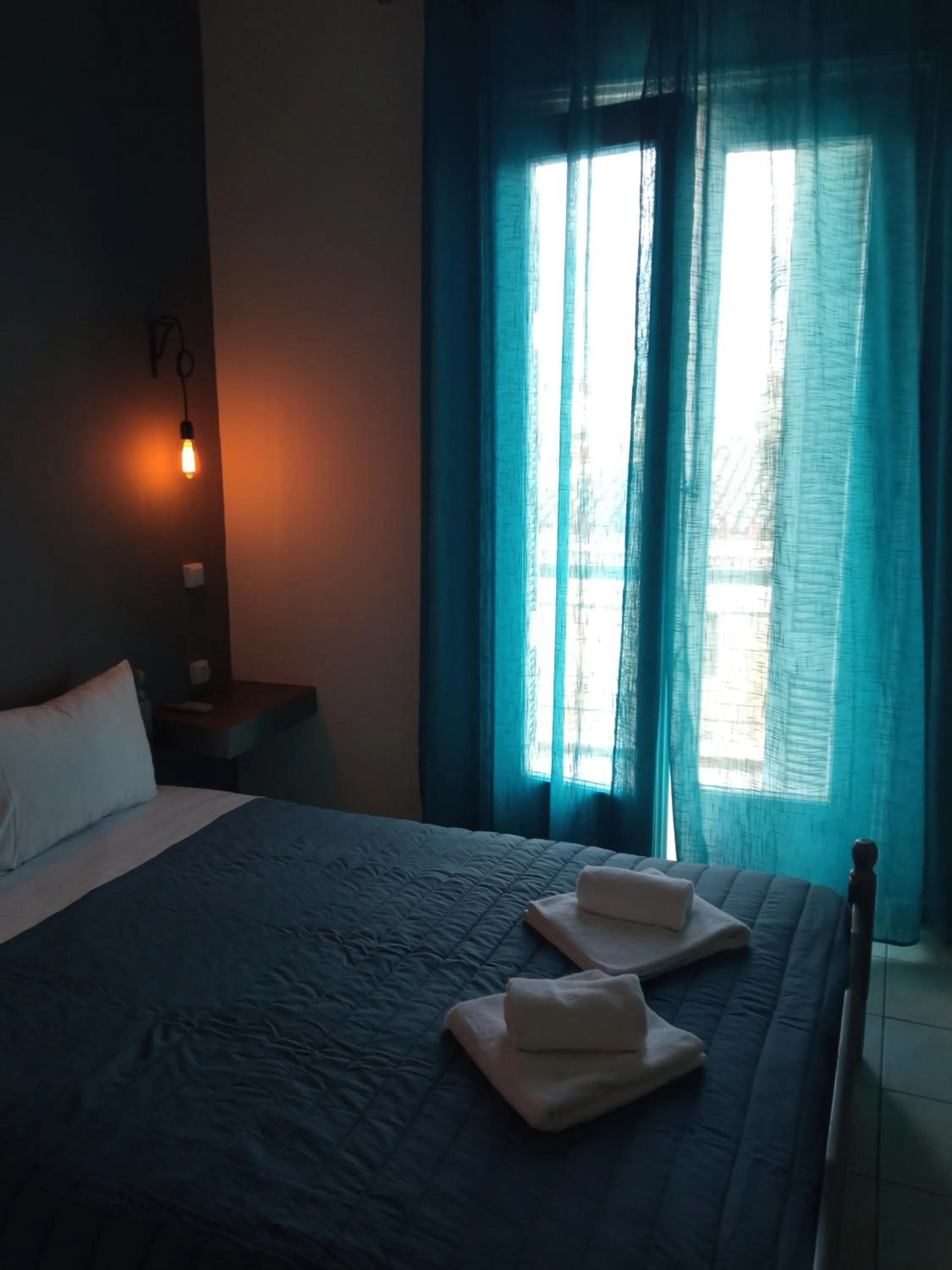 Bed in Hotel Theoxenia