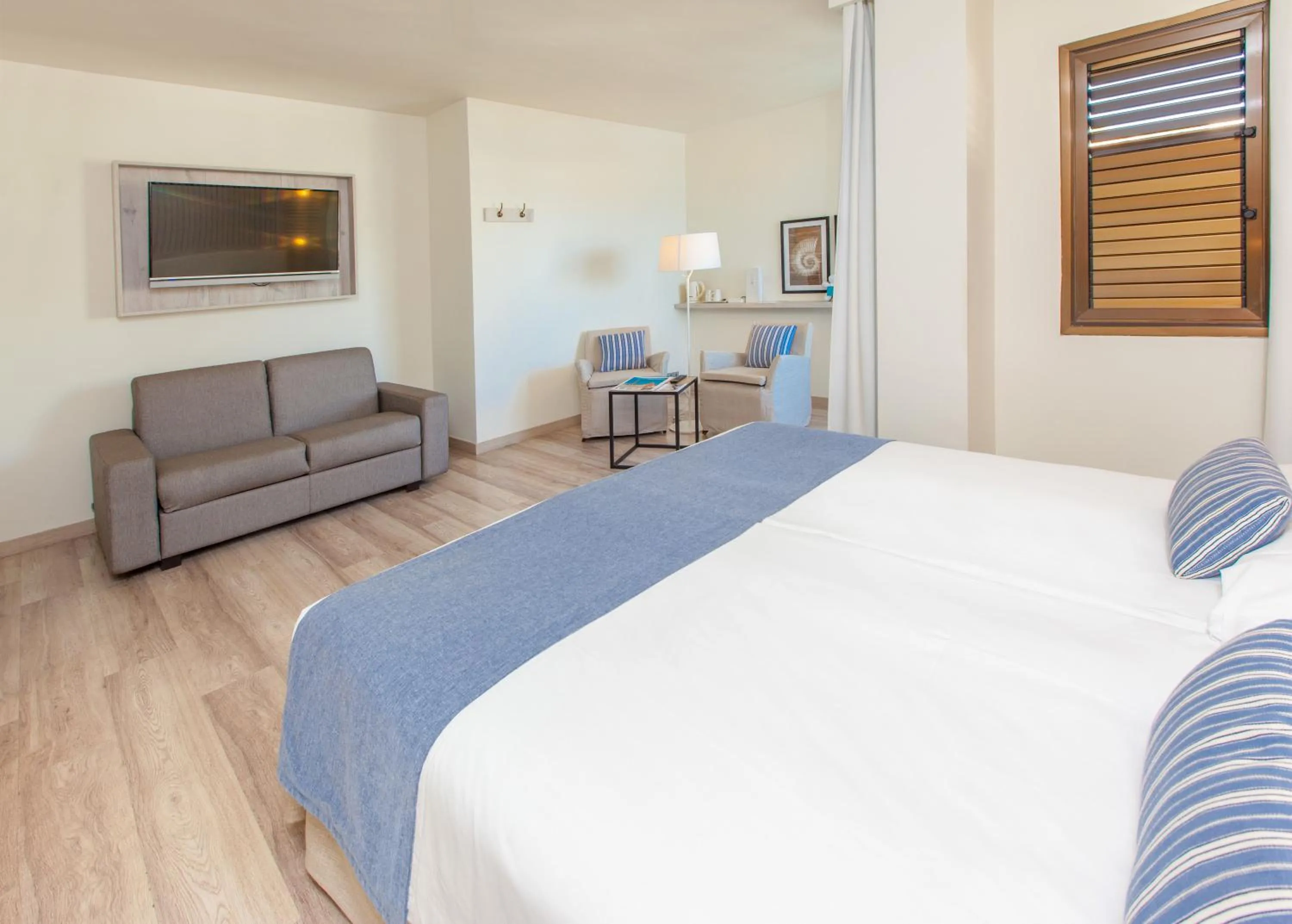 Photo of the whole room, Bed in Corallium Beach by Lopesan Hotels - Adults Only