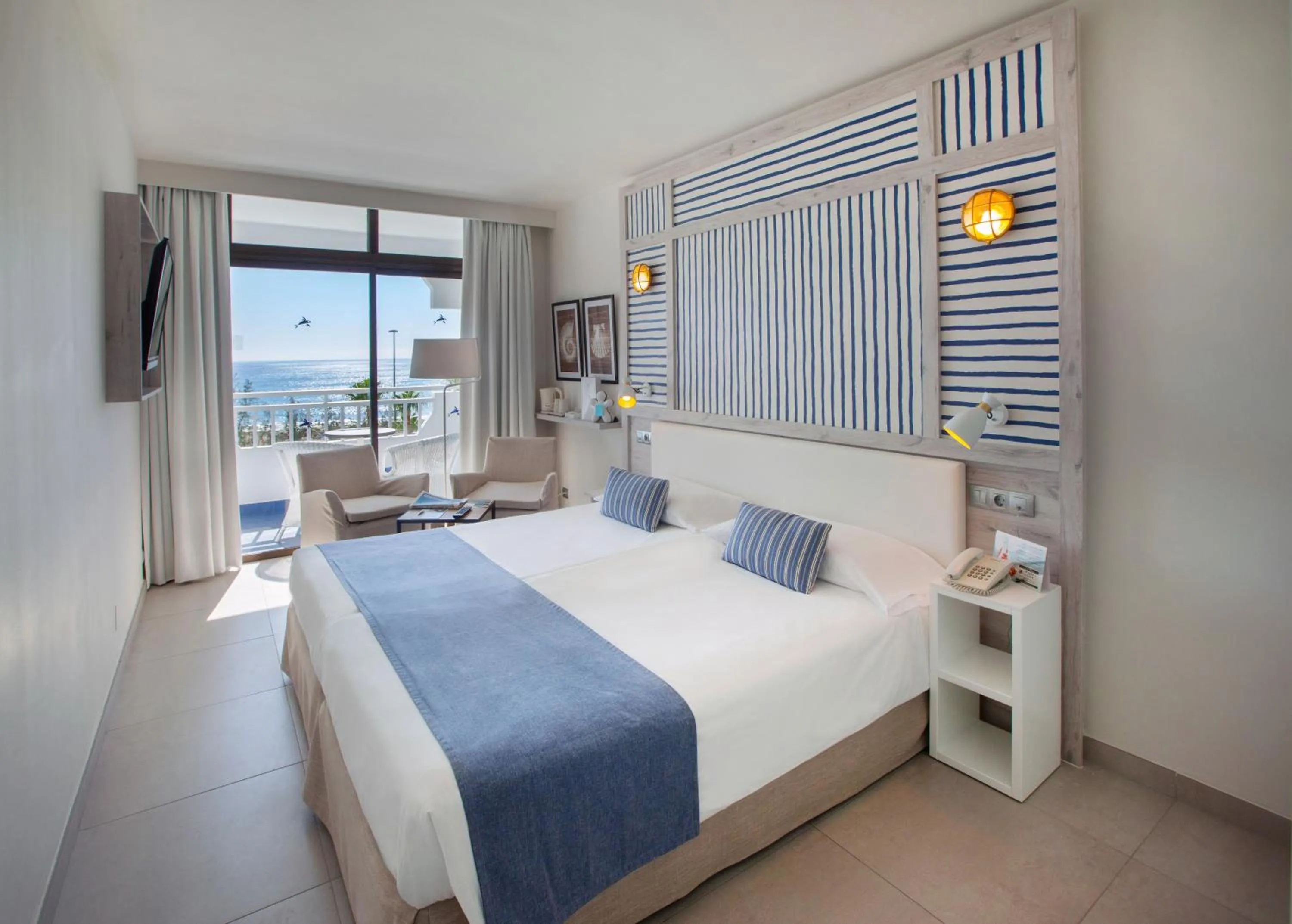 Photo of the whole room, Bed in Corallium Beach by Lopesan Hotels - Adults Only