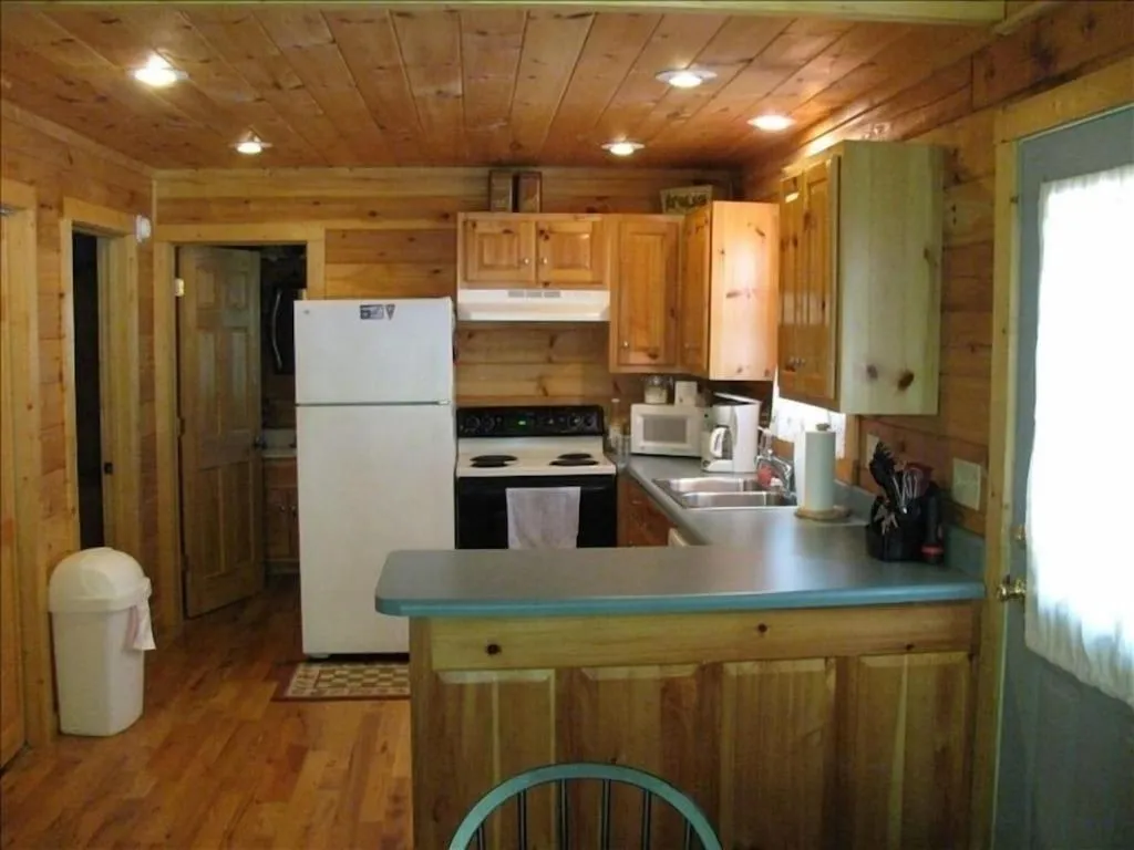 Kitchen or kitchenette in Alpenhaus Cabins Real Log Home in Helen Ga Mountains with hot tub and balconies