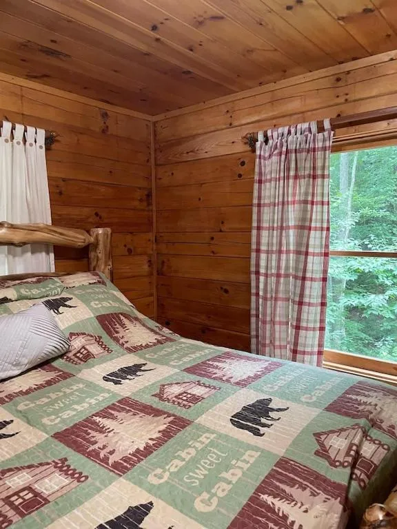 Bedroom, Bed in Alpenhaus Cabins Real Log Home in Helen Ga Mountains with hot tub and balconies