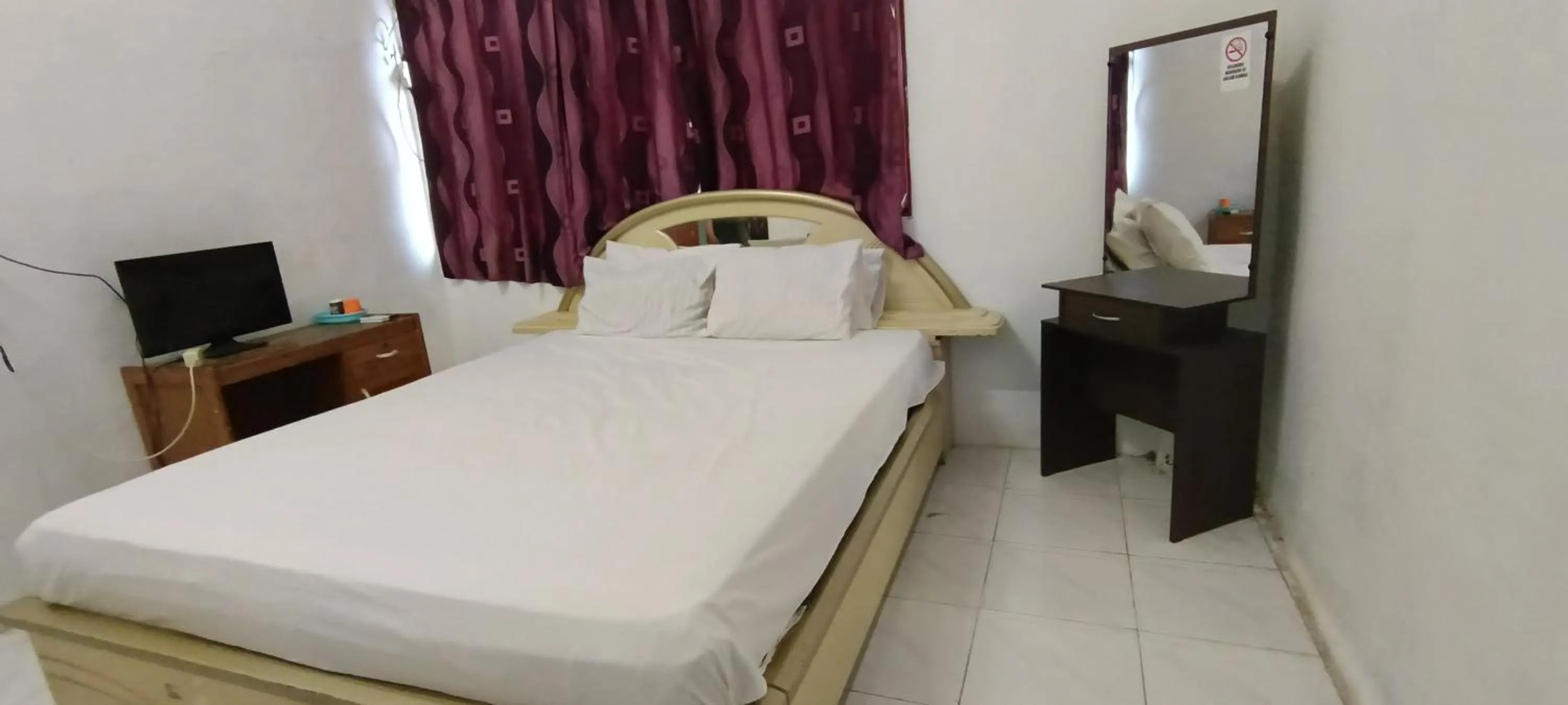 Bedroom in SPOT ON 92338 Karin Kost