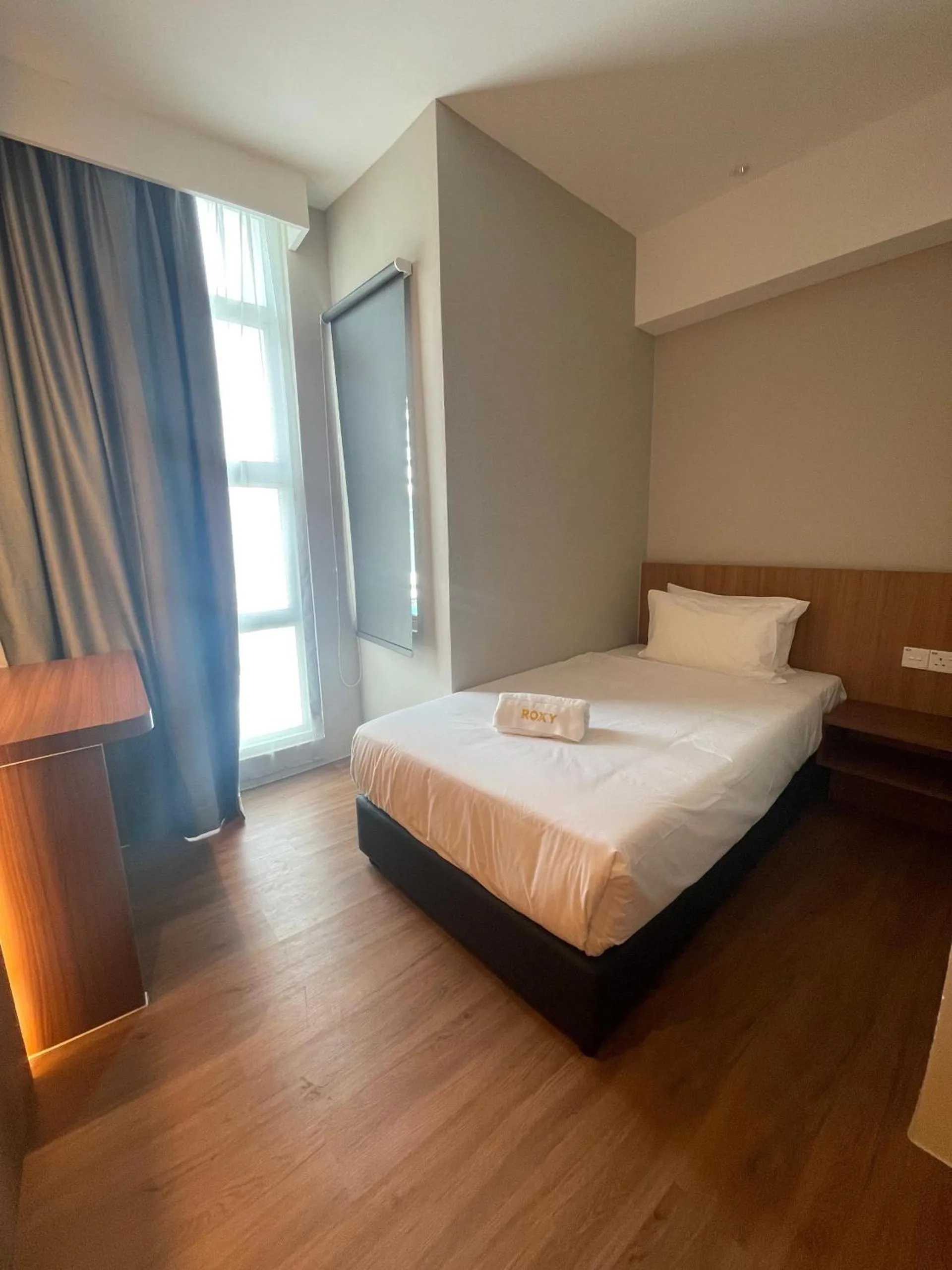 Bed in Roxy Hotel Aiman