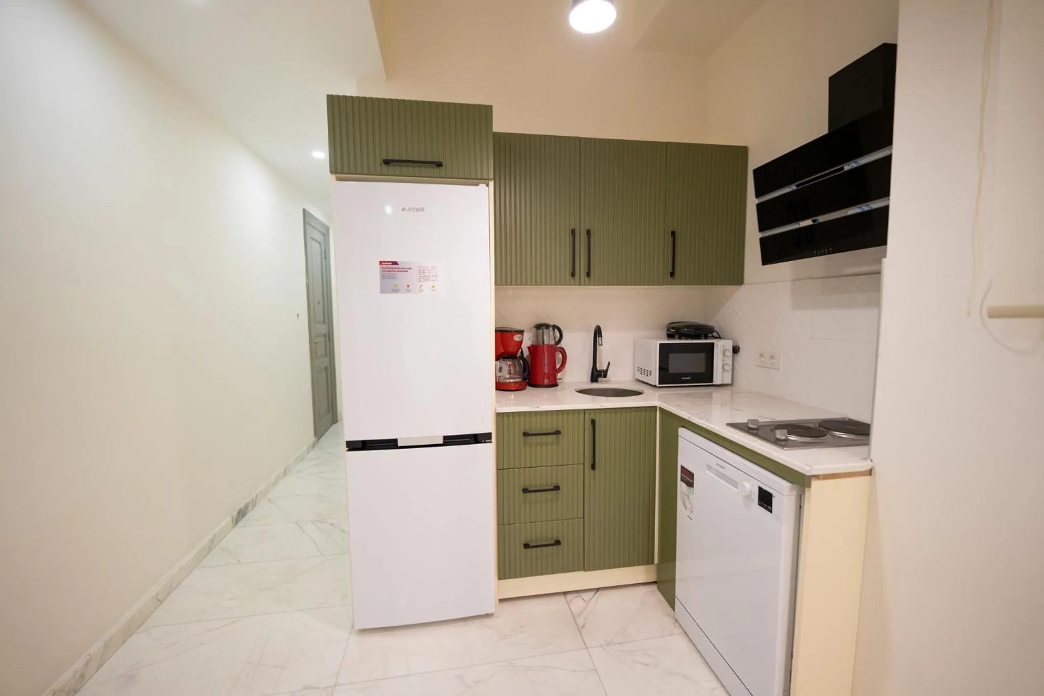 Kitchen or kitchenette in Monev Suites Hotel