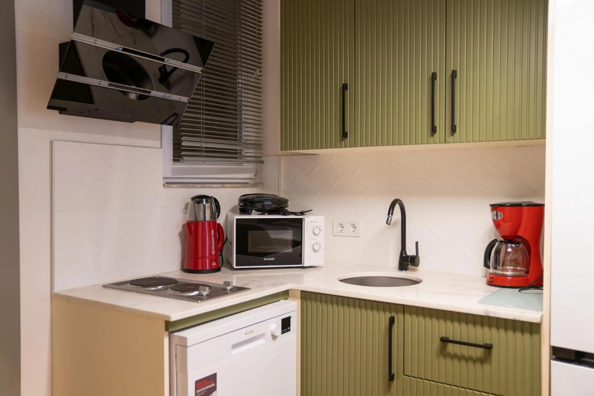 Kitchen or kitchenette in Monev Suites Hotel
