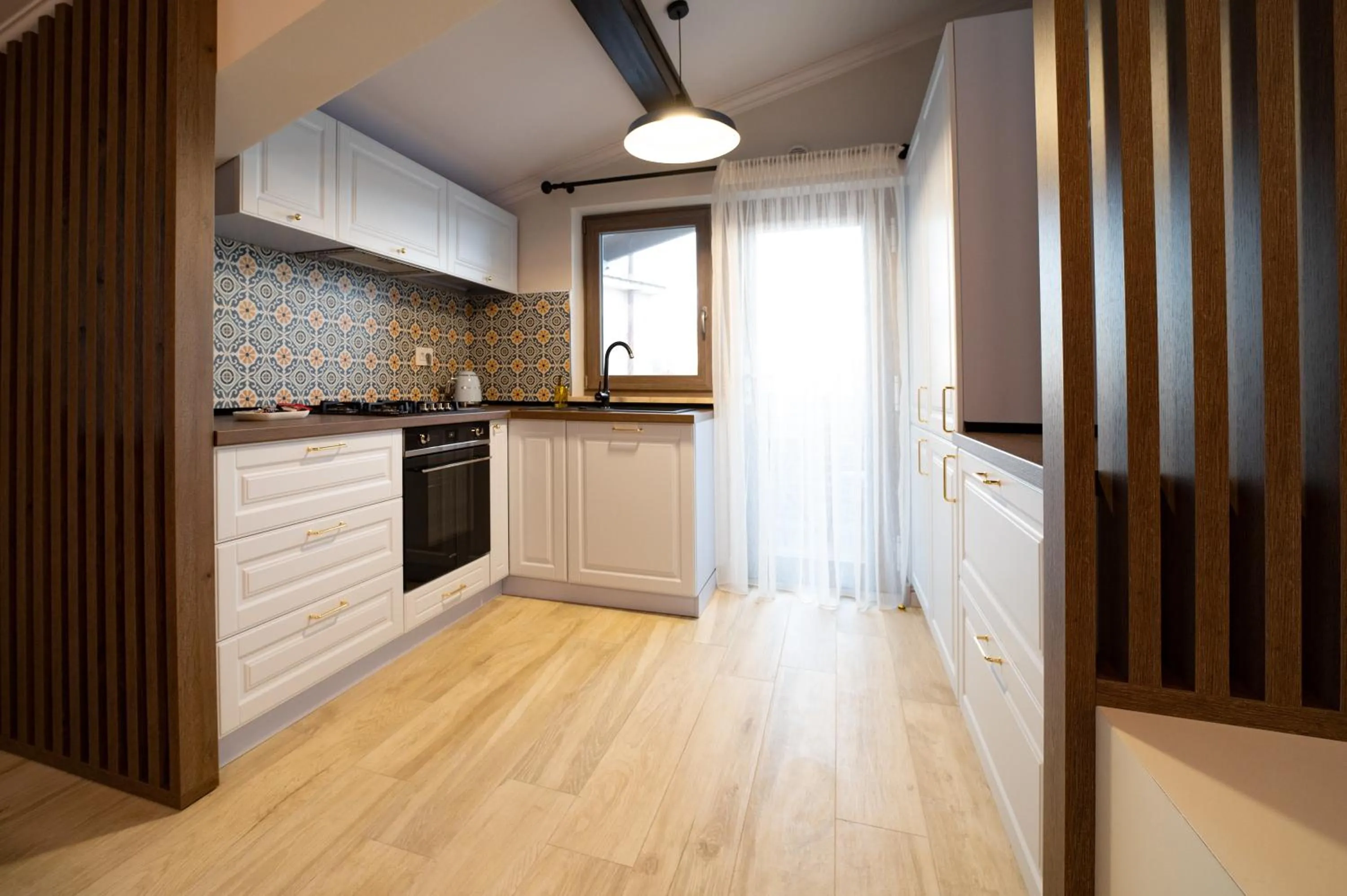 Kitchen or kitchenette in First Apartments