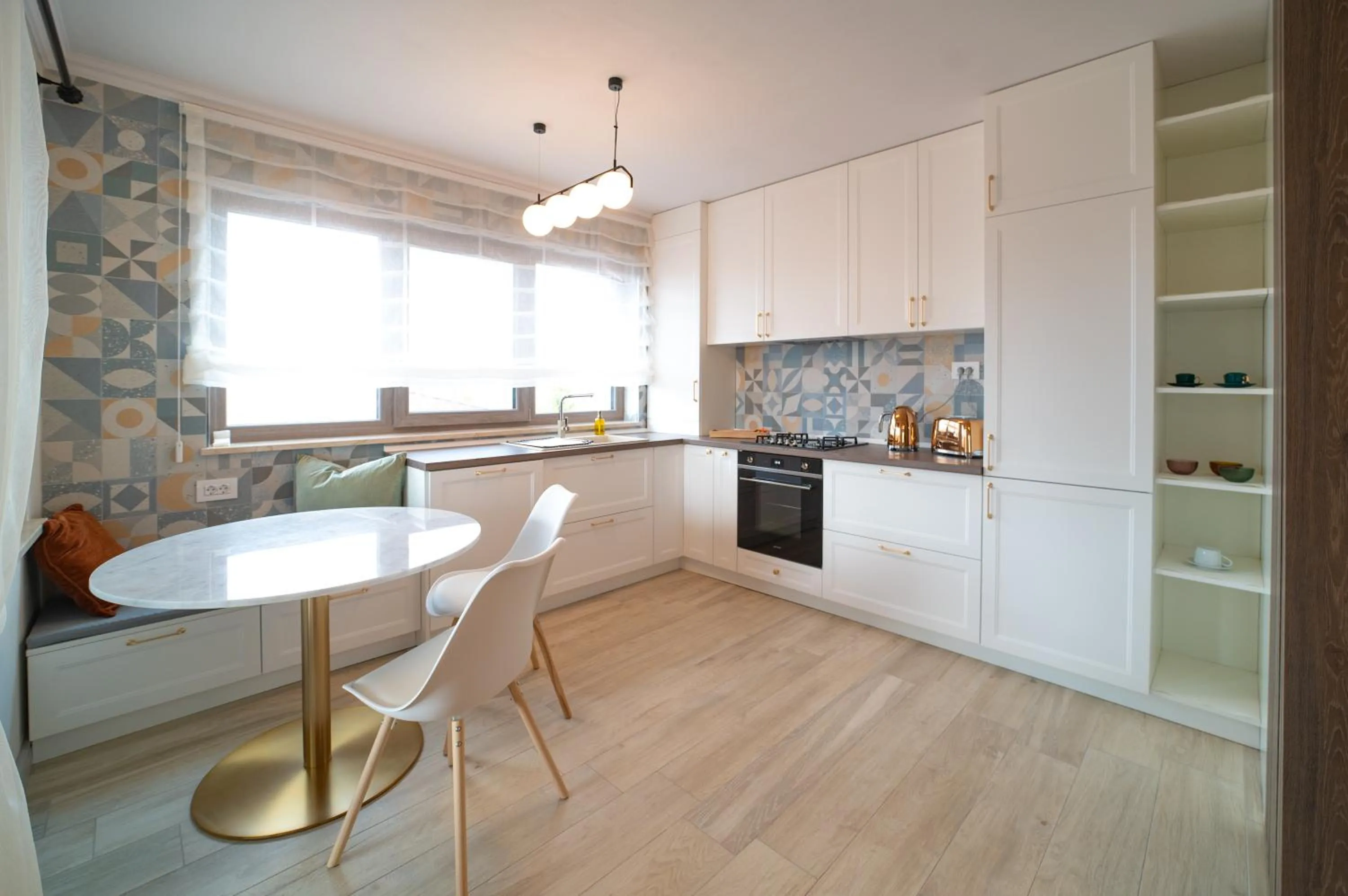 Kitchen or kitchenette in First Apartments