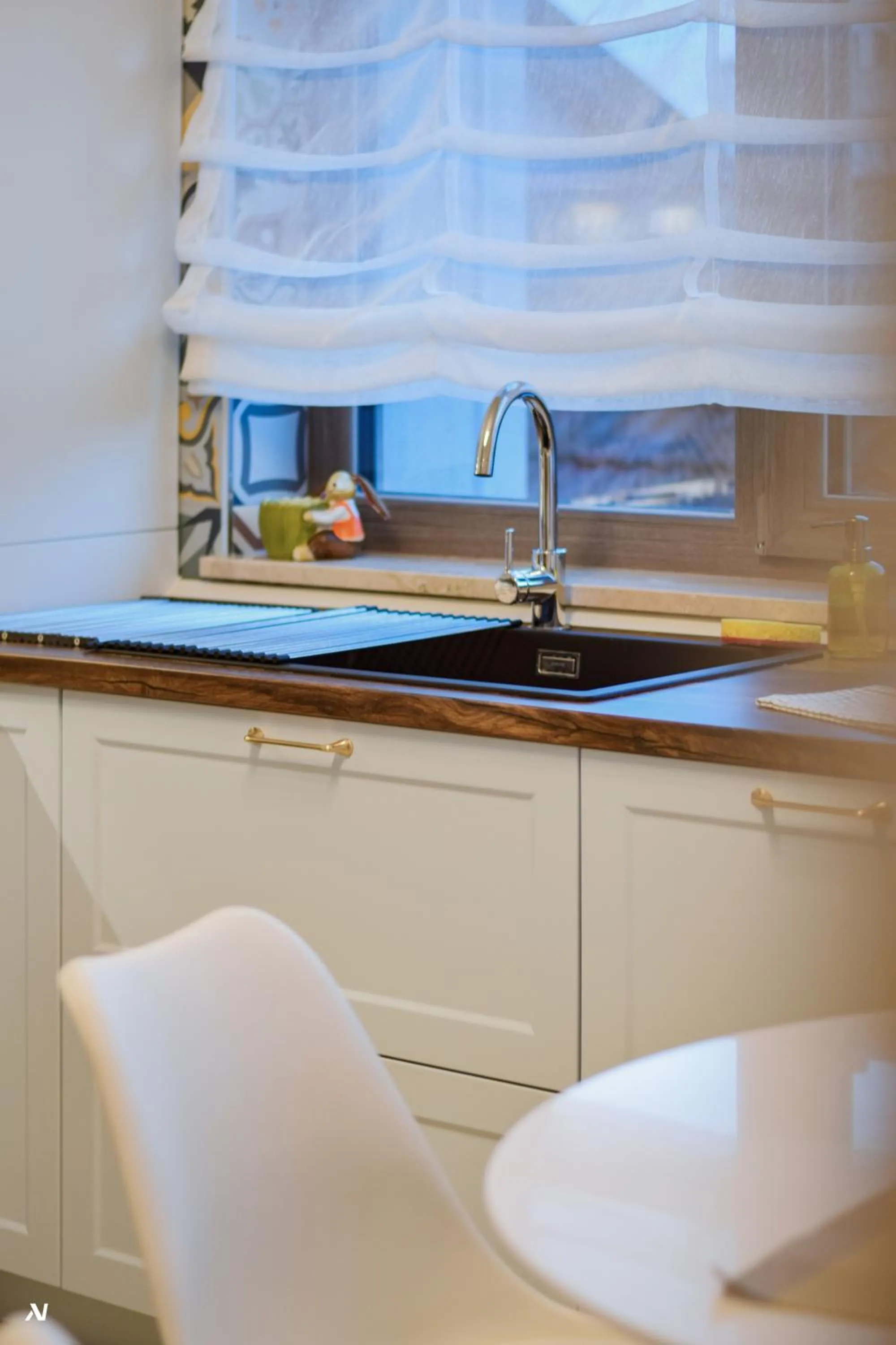 Kitchen or kitchenette in First Apartments