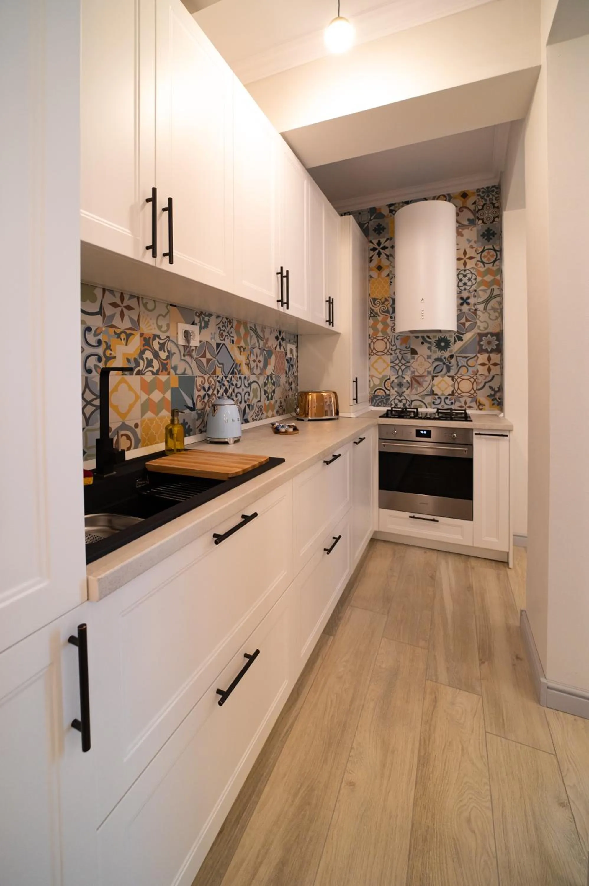 Kitchen or kitchenette in First Apartments