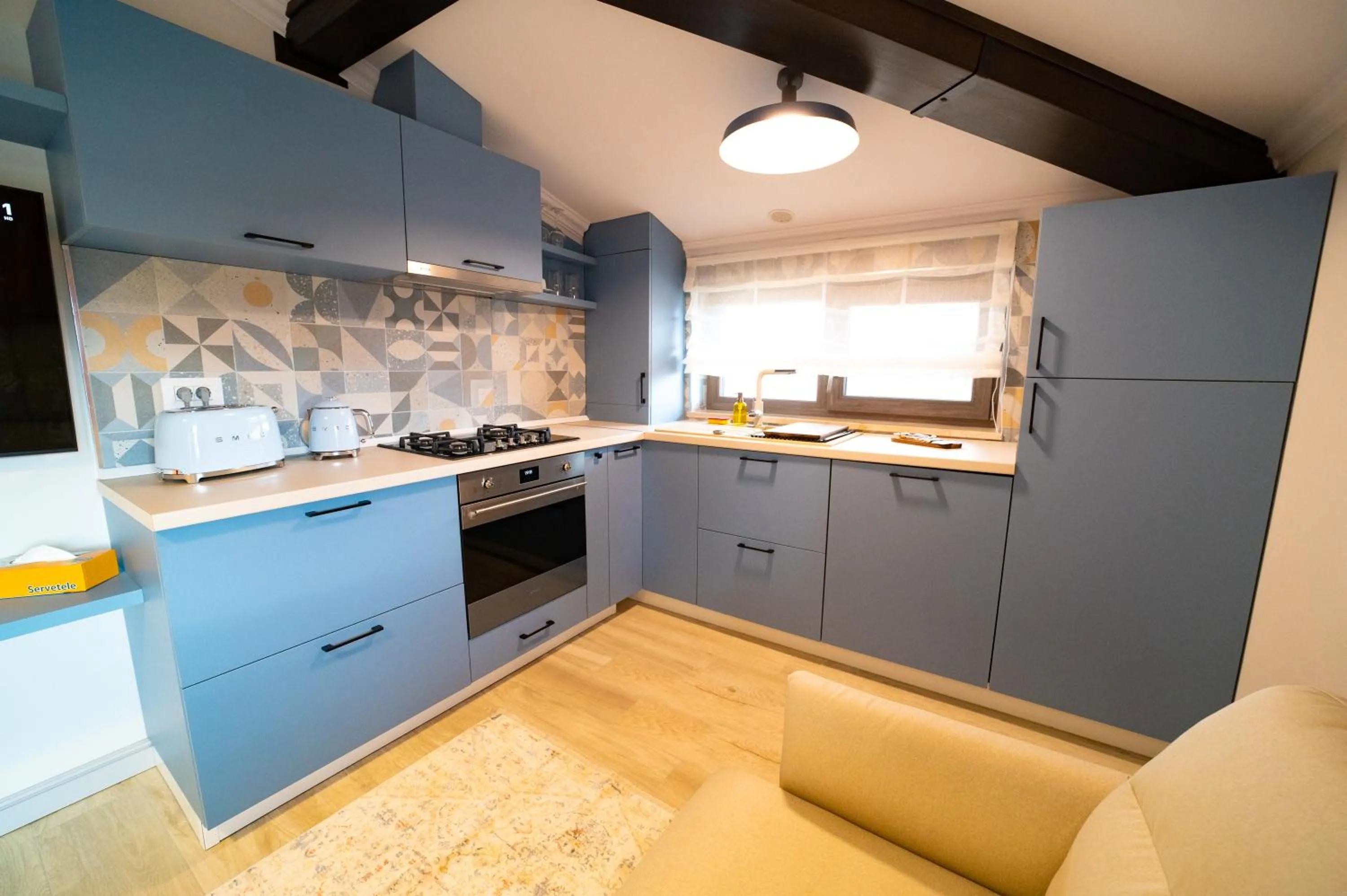 Kitchen or kitchenette in First Apartments