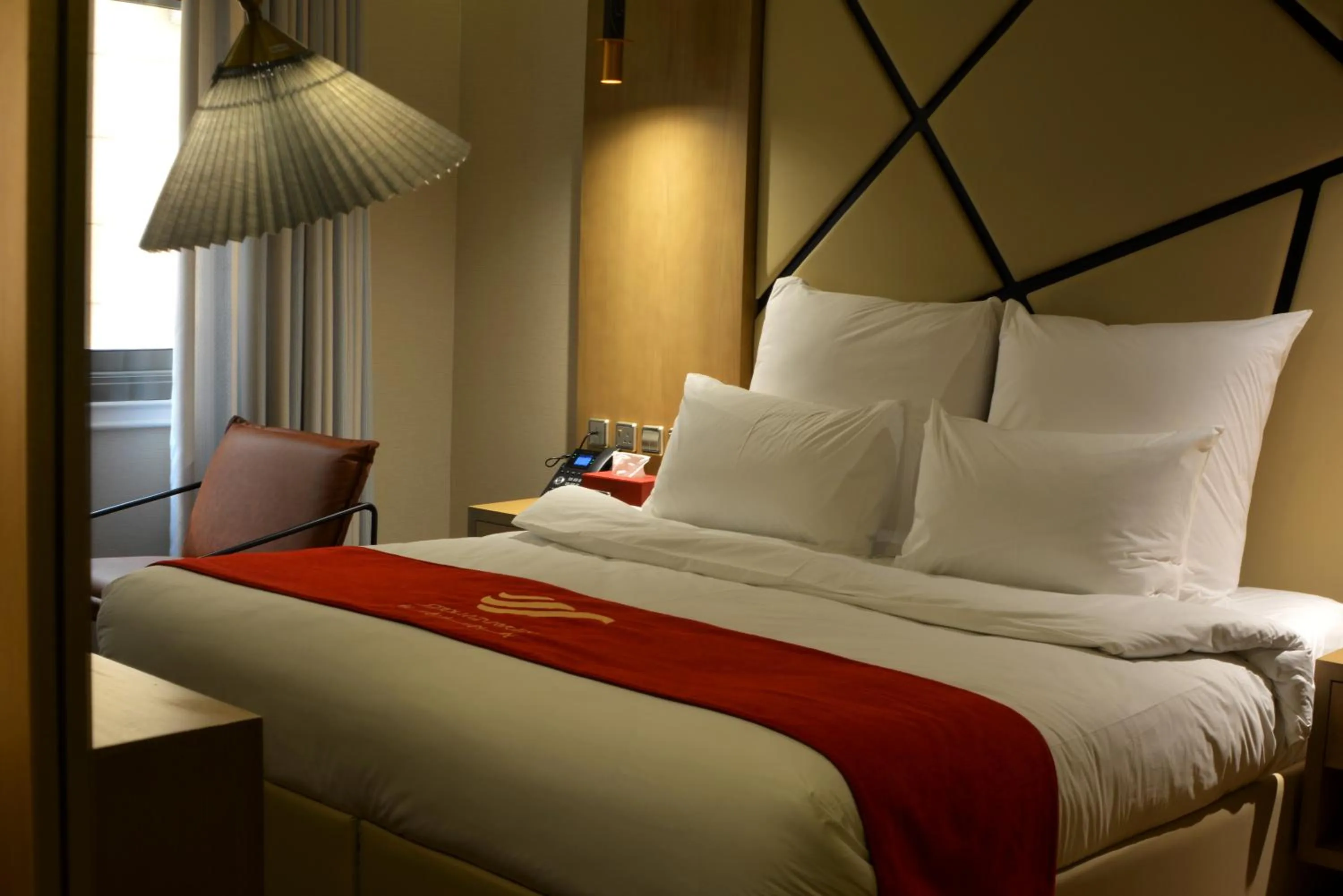 Bed in Redwaves Hotel